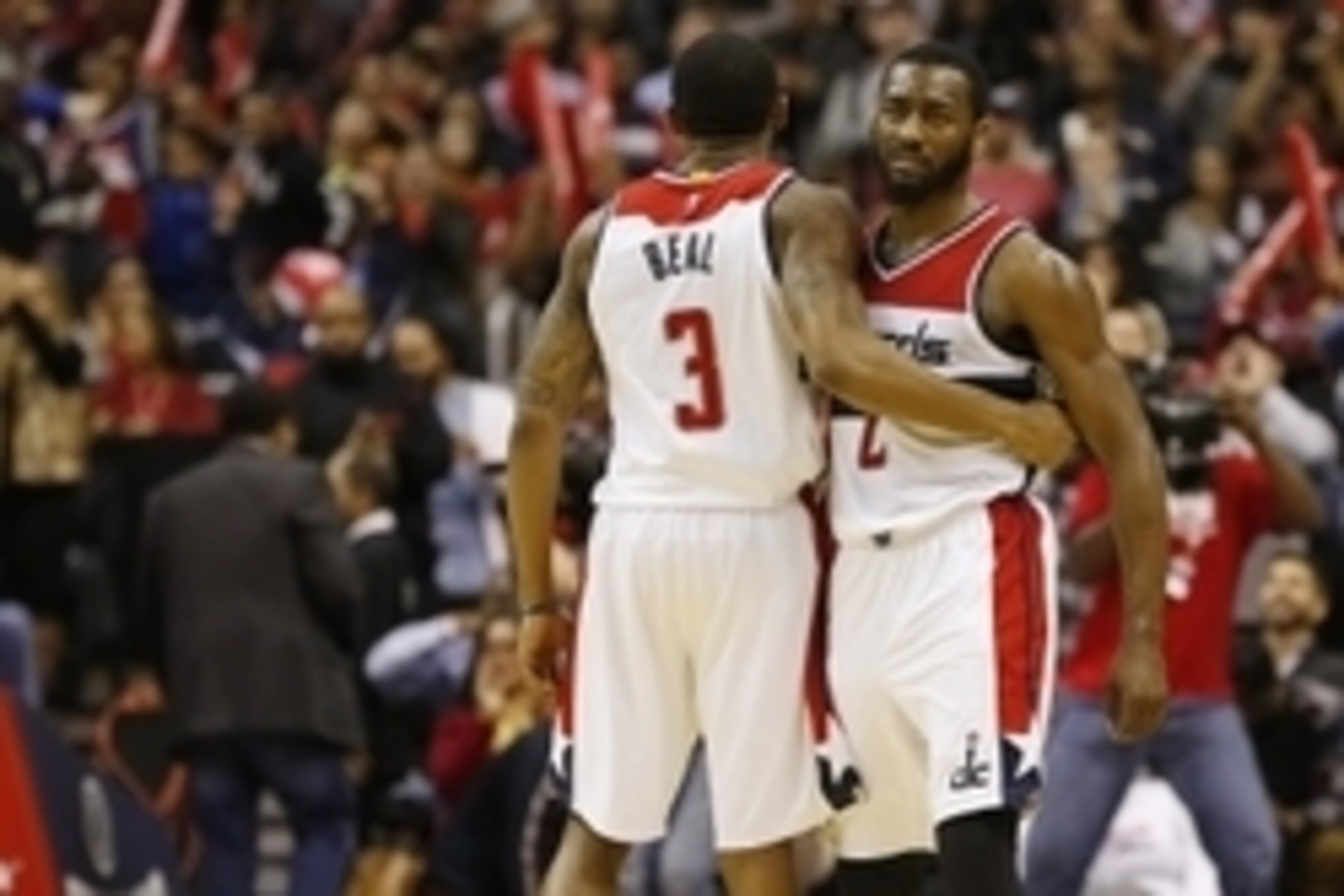 Dec 23, 2014; Washington, DC, USA; Washington Wizards guard Bradley Beal (3) hugs Wizards guard John Wall (2) against the Chicago Bulls in the fourth quarter at Verizon Center. The Bulls won 99-91. Mandatory Credit: Geoff Burke-USA TODAY Sports Dec 23, 2014; Washington, DC, USA; Washington Wizards guard Bradley Beal (3) hugs Wizards guard John Wall (2) against the Chicago Bulls in the fourth quarter at Verizon Center. The Bulls won 99-91. Mandatory Credit: Geoff Burke-USA TODAY Sports