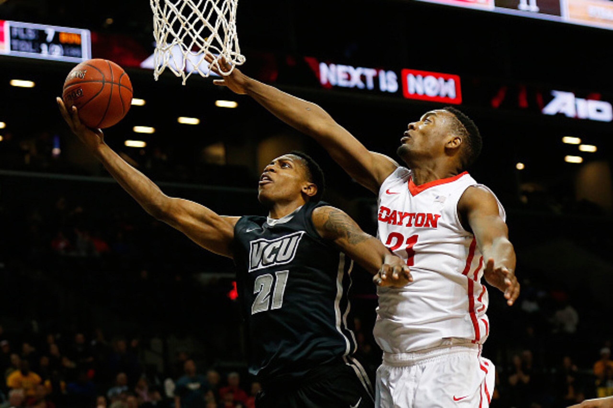 NEW YORK, NY - MARCH 15:  Dyshawn Pierre #21 of the Dayton Flyers defends against Treveon Graham #21 of the Virginia Commonwealth Rams during the Atlantic 10 Basketball Tournament - Championship game at Barclays Center on March 15, 2015 in New York, New Y