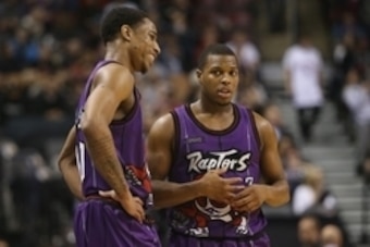 Feb 6, 2015; Toronto, Ontario, CAN; Toronto Raptors guard DeMar DeRozan (10) talks to point guard Kyle Lowry (7) during a break in the action against the Los Angeles Clippers at Air Canada Centre. The Raptors beat the Clippers 123-107. Mandatory Credit: T