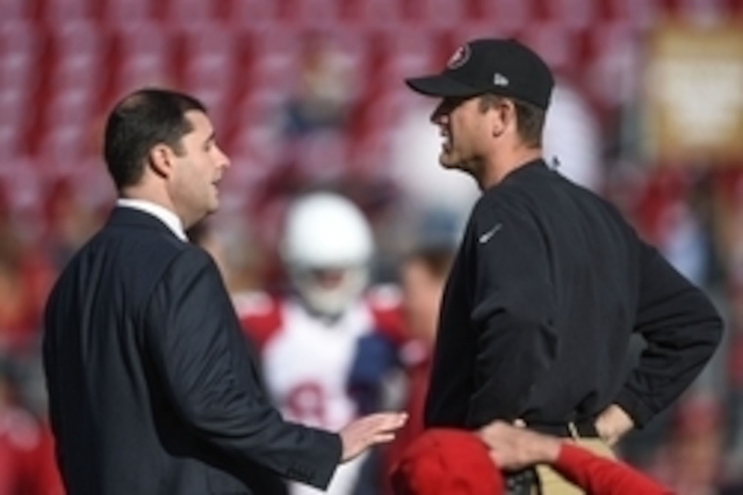 December 28, 2014; Santa Clara, CA, USA; San Francisco 49ers chief executive officer Jed York (left) talks to head coach Jim Harbaugh (right) before the game against the Arizona Cardinals at Levi's Stadium. Mandatory Credit: Kyle Terada-USA TODAY Sports