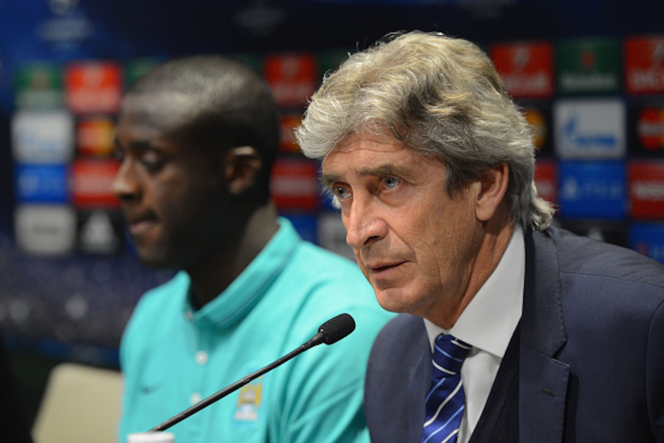 BARCELONA, SPAIN - MARCH 17:  Manchester City manager Manuel Pellegrini speaks to the media with manchester City player Yaya Toure during the Manchester City Press Conference at the W Hotel on March 17, 2015 in Barcelona, Spain.  (Photo by Michael Regan/G