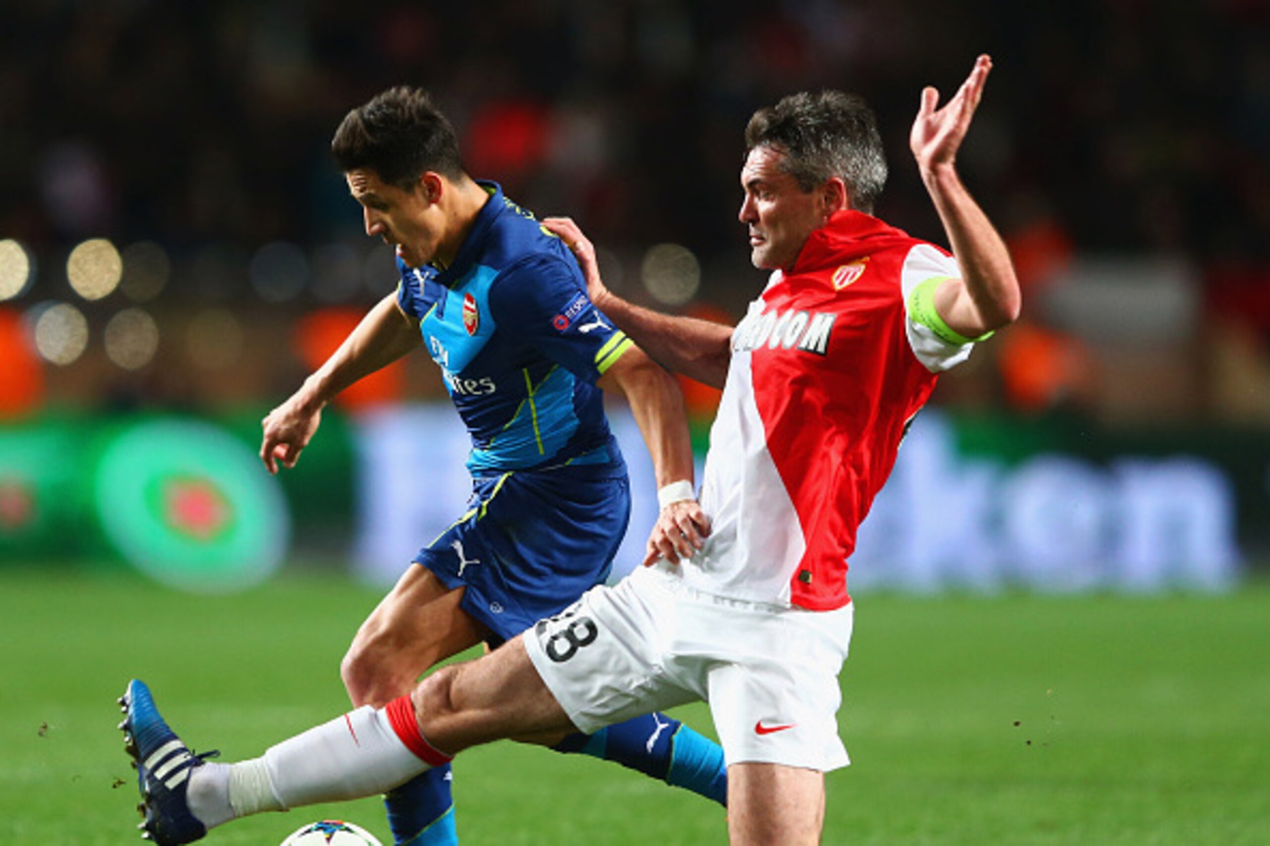 MONACO - MARCH 17:  Alexis Sanchez of Arsenal takes on Jeremy Toulalan of Monaco during the UEFA Champions League round of 16 second leg match between AS Monaco and Arsenal at Stade Louis II on March 17, 2015 in Monaco, Monaco.  (Photo by Michael Steele/G