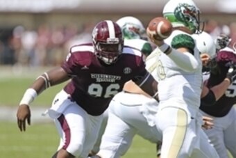 Sep 6, 2014; Starkville, MS, USA; Mississippi State Bulldogs defensive lineman Chris Jones (96) attempts to tackle UAB Blazers quarterback Jeremiah Briscoe (16) during the game at Davis Wade Stadium. Mandatory Credit: Spruce Derden-USA TODAY Sports