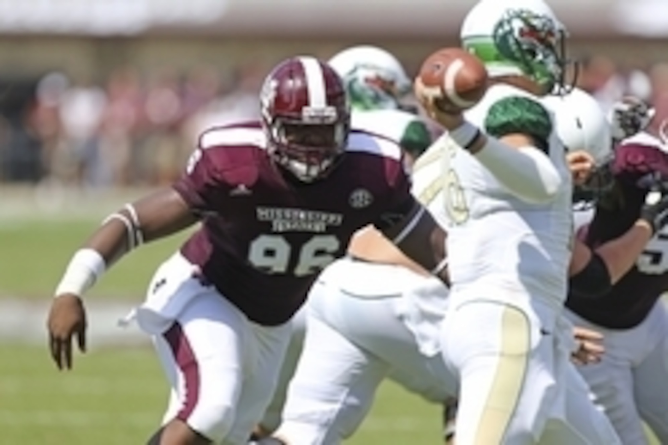 Sep 6, 2014; Starkville, MS, USA; Mississippi State Bulldogs defensive lineman Chris Jones (96) attempts to tackle UAB Blazers quarterback Jeremiah Briscoe (16) during the game at Davis Wade Stadium. Mandatory Credit: Spruce Derden-USA TODAY Sports