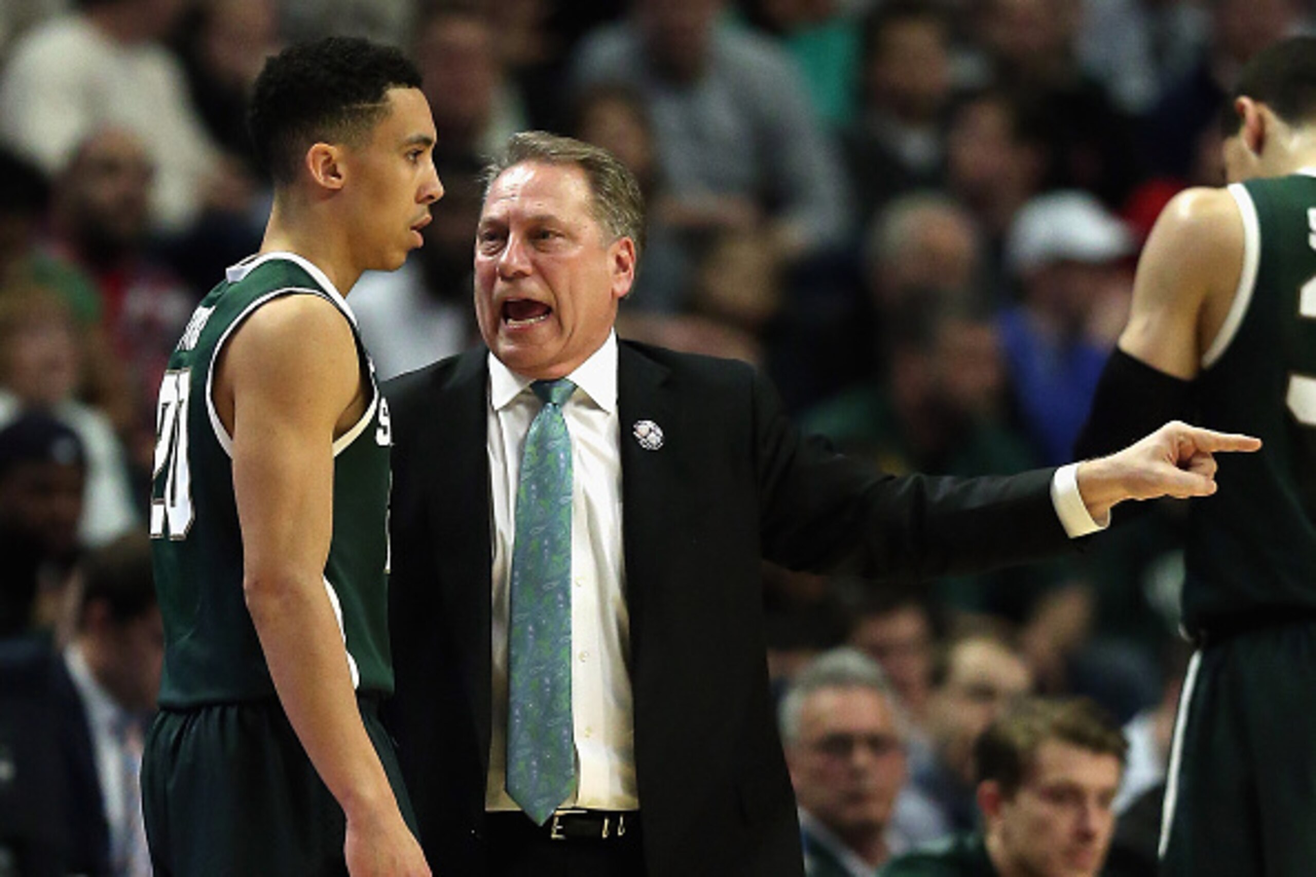 CHICAGO, IL - MARCH 15: Head coach Tom Izzo of the Michigan State Spartans gives instructions to Travis Trice #20 as they take on the Wisconsin Badgers during the Championship game of the 2015 Big Ten Men's Basketball Tournament at the United Center on Ma