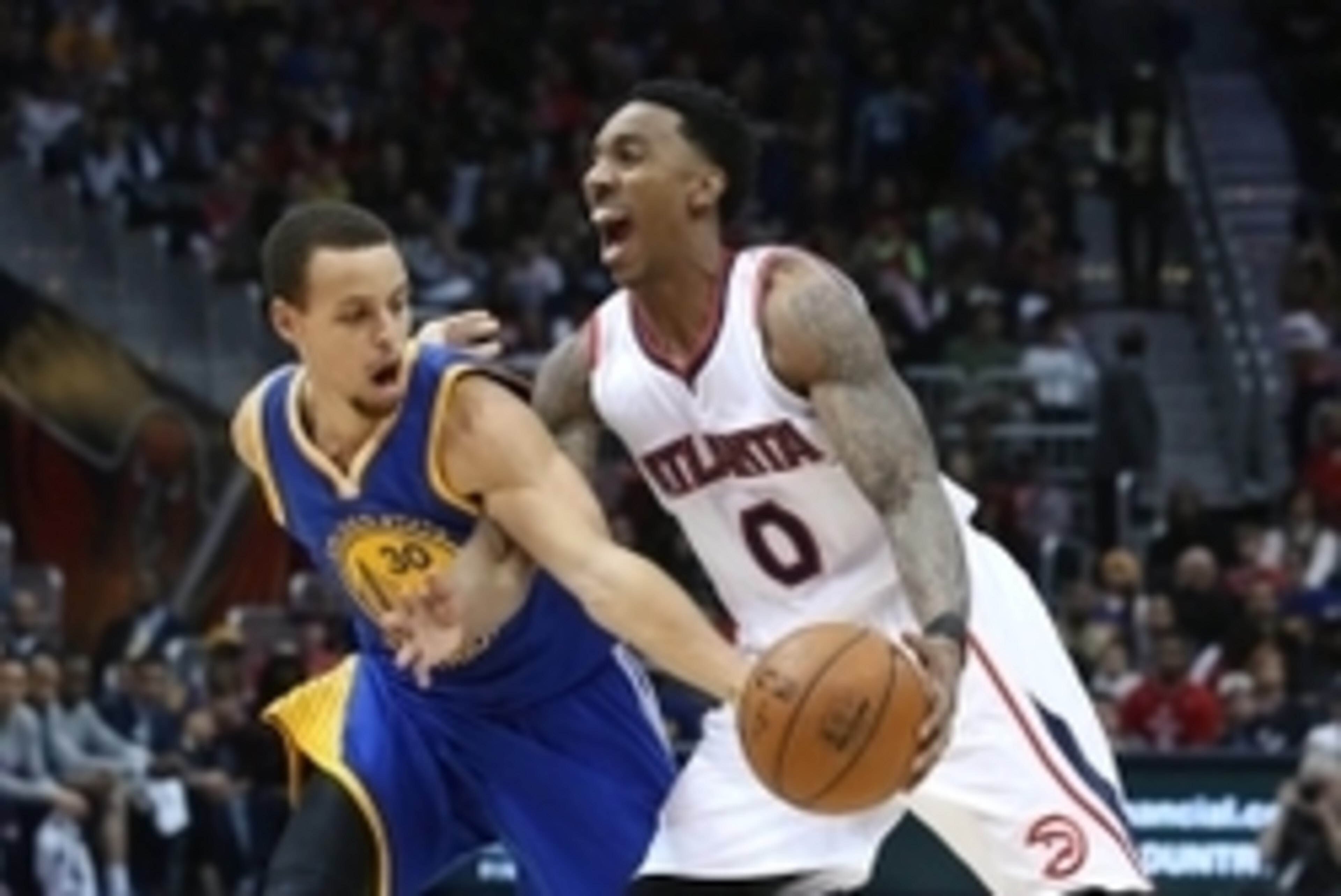 Feb 6, 2015; Atlanta, GA, USA; Atlanta Hawks guard Jeff Teague (0) is fouled by Golden State Warriors guard Stephen Curry (30) on a steal attempt in the third quarter of their game at Philips Arena. The Hawks won 124-116. Mandatory Credit: Jason Getz-USA 