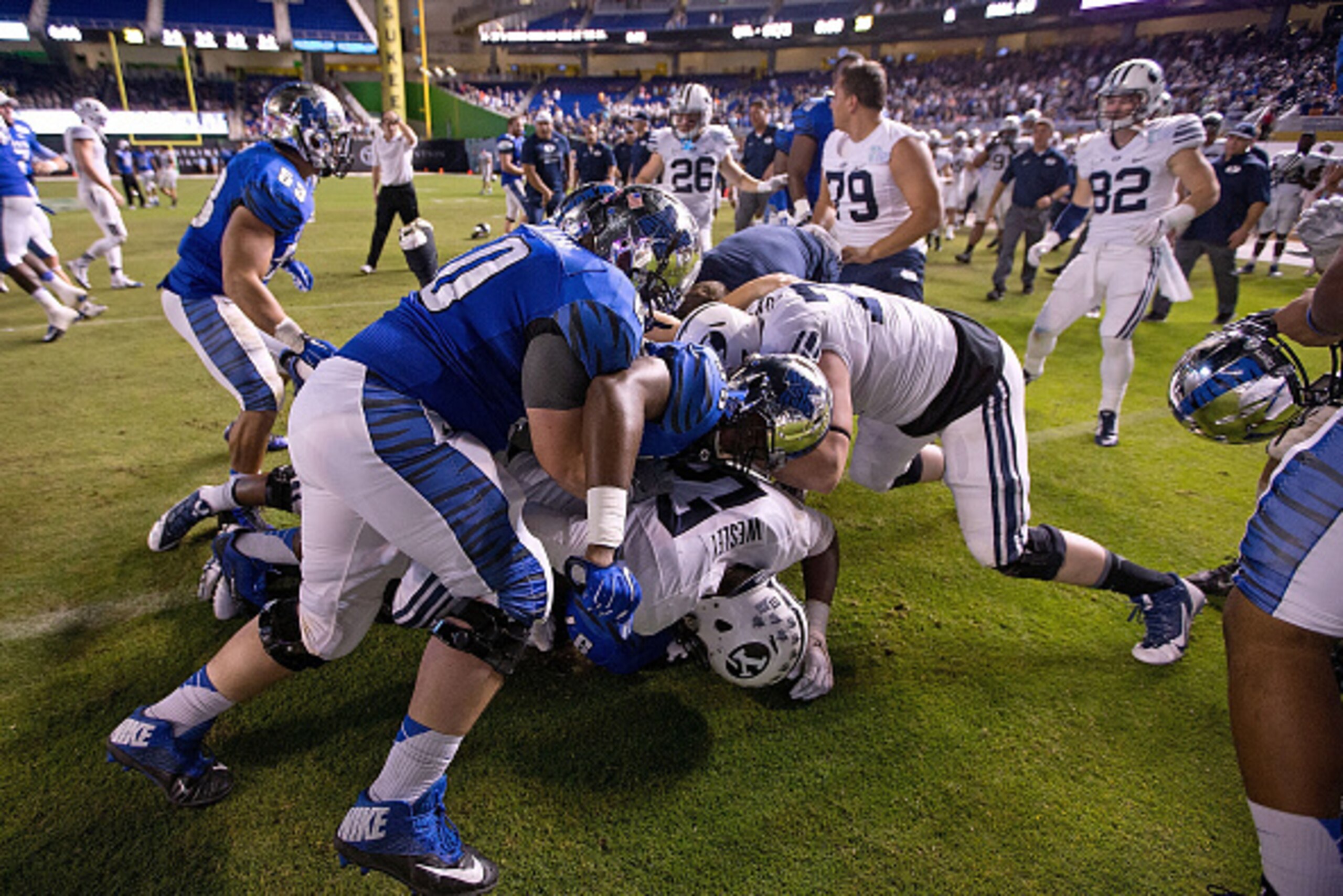 MIAMI, FL - DECEMBER 22:  A fight breaks out on the field after the game between the Brigham Young Cougars and the Memphis Tigers at Marlins Park on December 22, 2014 in Miami, Florida.  (Photo by Rob Foldy/Getty Images)
