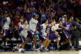 SAN DIEGO, CA - MARCH 21:  The Stephen F. Austin Lumberjacks bench runs on to the court to celebrate their 77-75 overtime win against the Virginia Commonwealth Rams during the second round of the 2014 NCAA Men's Basketball Tournament at Viejas Arena on Ma