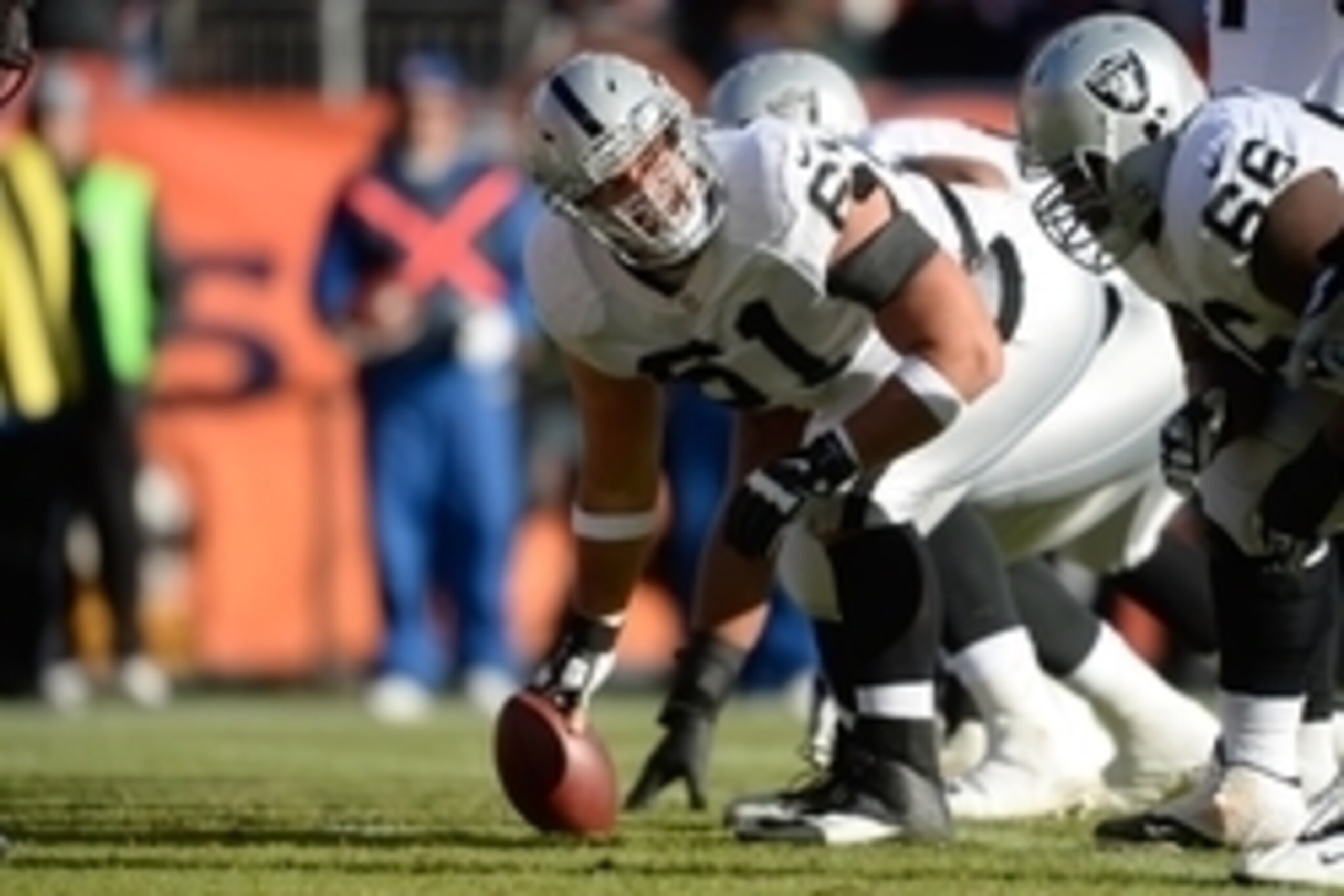 Dec 28, 2014; Denver, CO, USA; Oakland Raiders center Stefen Wisniewski (61) lines up against the Denver Broncos in the first quarter at Sports Authority Field at Mile High. Mandatory Credit: Ron Chenoy-USA TODAY Sports