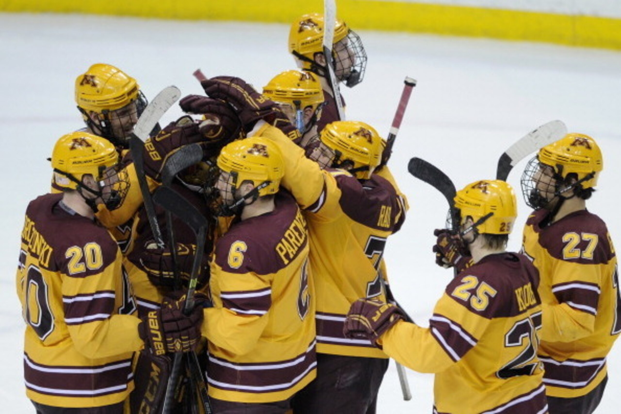 ST PAUL, MN - MARCH 29: The Minnesota Golden Gophers celebrate a win of the West Regional game against the Robert Morris Colonials of the 2014 NCAA Division I Men's Ice Hockey Championship on March 29, 2014 at Xcel Energy Center in St Paul, Minnesota. The ST PAUL, MN - MARCH 29: The Minnesota Golden Gophers celebrate a win of the West Regional game against the Robert Morris Colonials of the 2014 NCAA Division I Men's Ice Hockey Championship on March 29, 2014 at Xcel Energy Center in St Paul, Minnesota. The