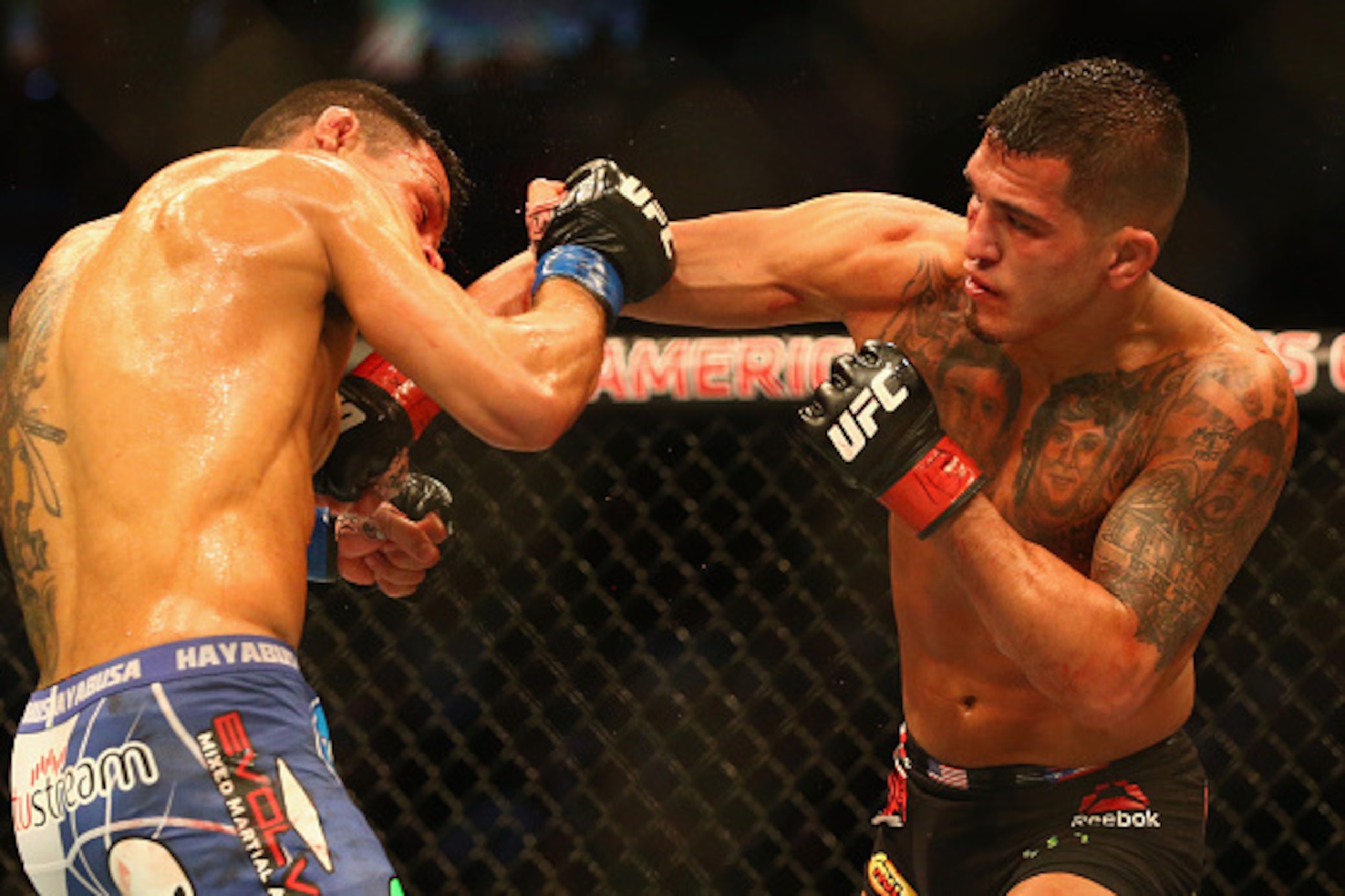 DALLAS, TX - MARCH 14:  (L-R) Rafael dos Anjos fights with Anthony Pettis in the Lightweight Title bout during the UFC 185 event at American Airlines Center on March 14, 2015 in Dallas, Texas.  (Photo by Ronald Martinez/Getty Images)