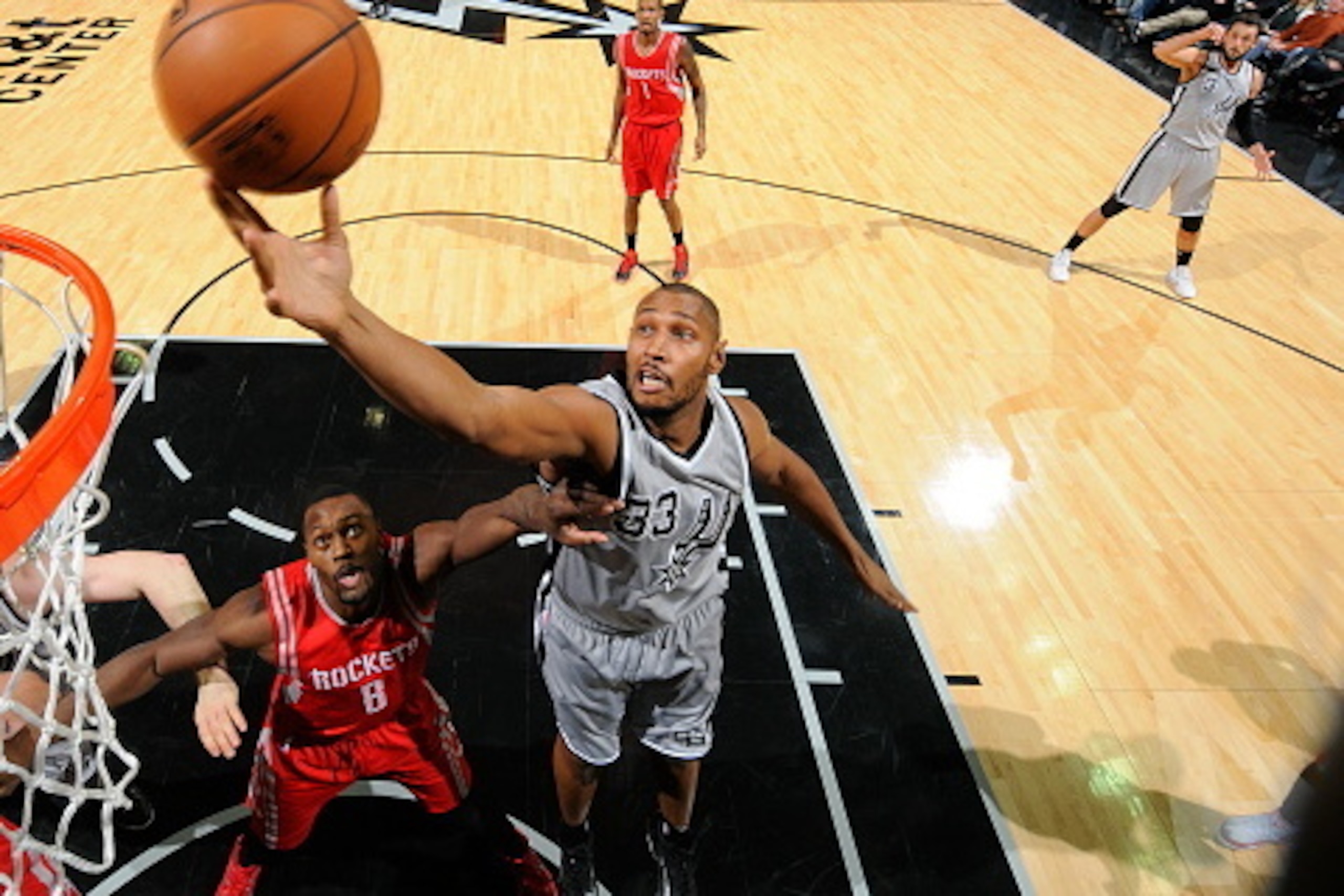 SAN ANTONIO, TX - DECEMBER 28:  Boris Diaw #33 of the San Antonio Spurs grabs the rebound against the Houston Rockets during the game on December 28, 2014 at the AT&T Center in San Antonio, Texas. NOTE TO USER: User expressly acknowledges and agrees that,