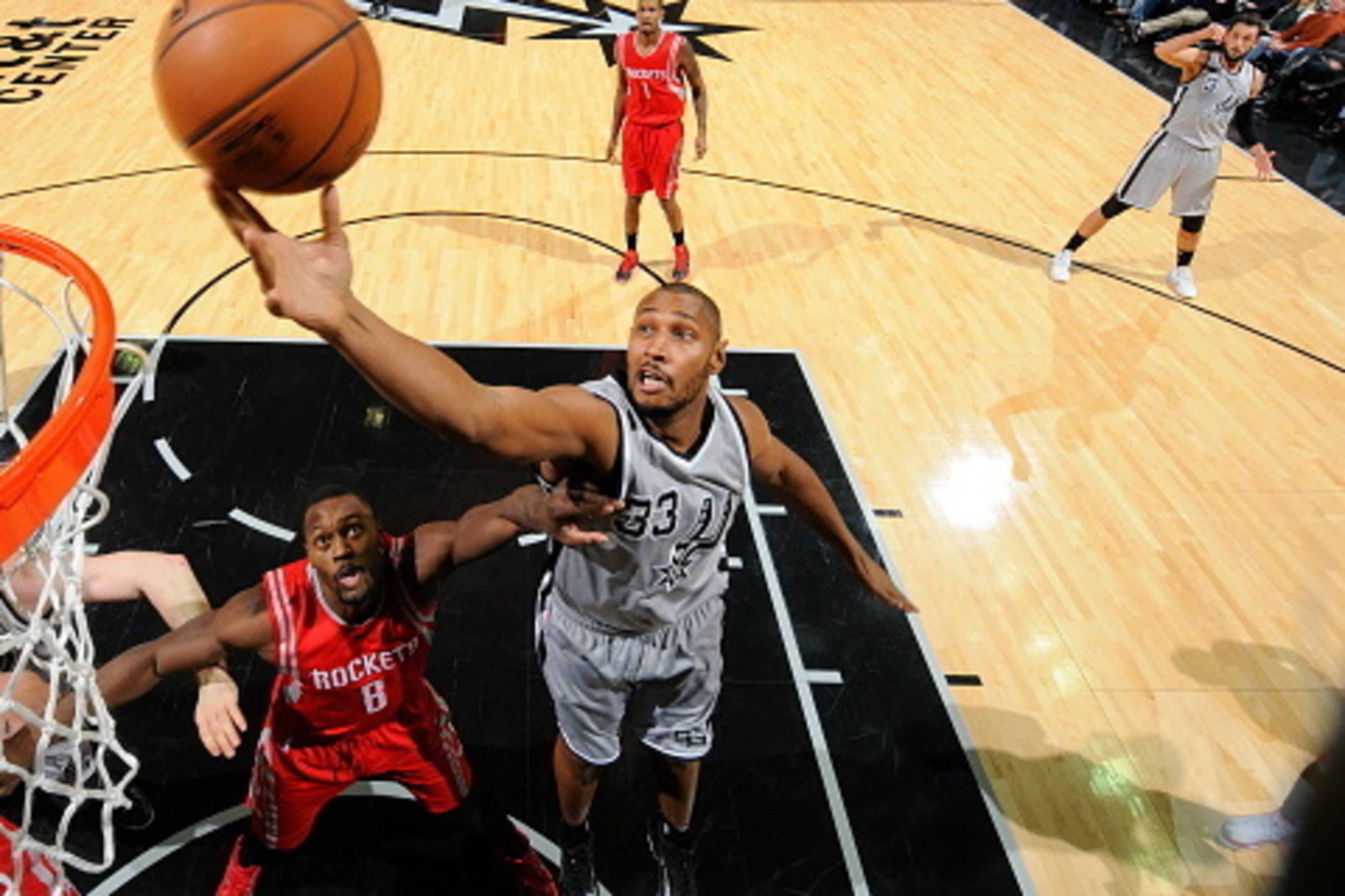 SAN ANTONIO, TX - DECEMBER 28:  Boris Diaw #33 of the San Antonio Spurs grabs the rebound against the Houston Rockets during the game on December 28, 2014 at the AT&T Center in San Antonio, Texas. NOTE TO USER: User expressly acknowledges and agrees that,