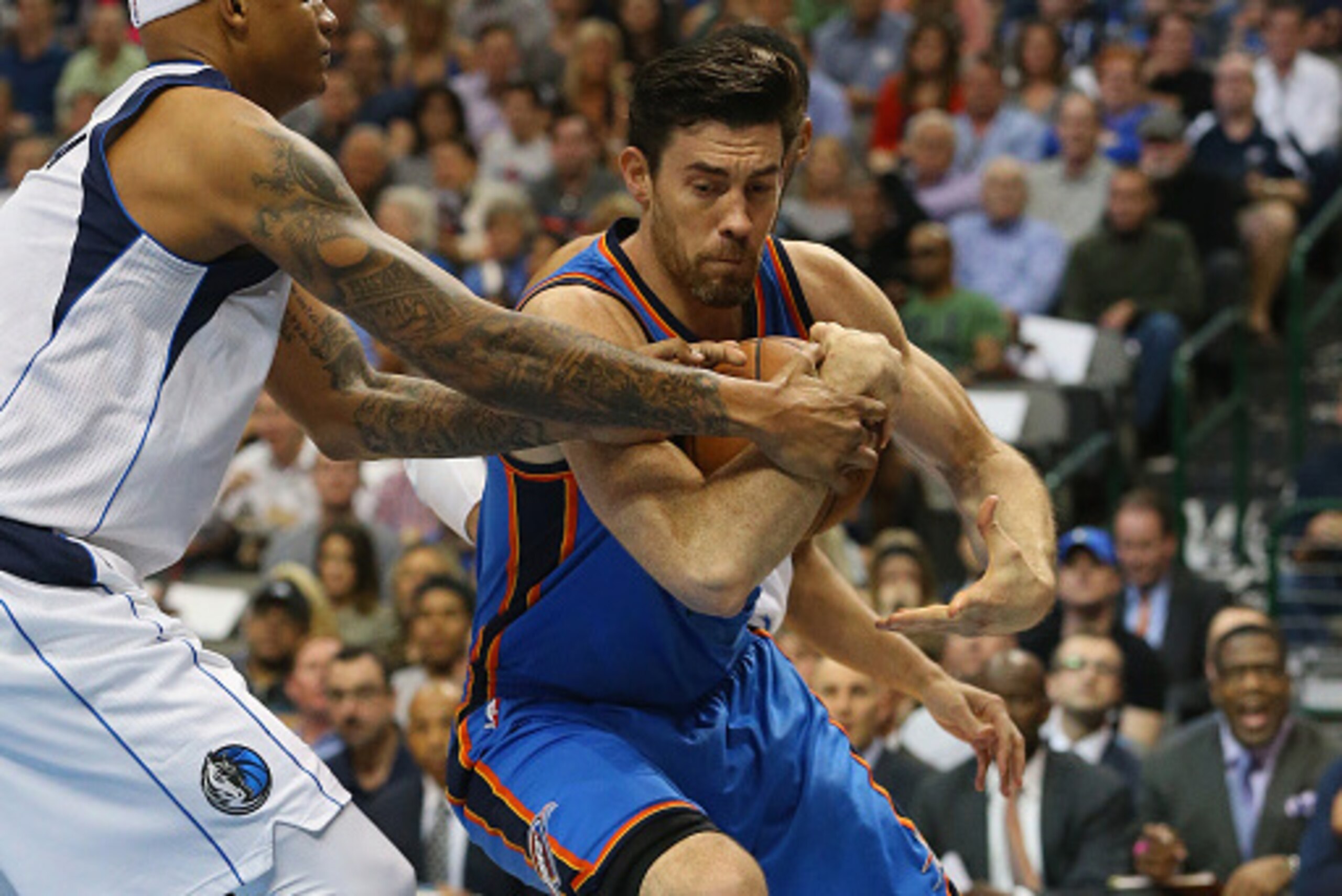 DALLAS, TX - MARCH 16:  Nick Collison #4 of the Oklahoma City Thunder is fouled by Charlie Villanueva #3 of the Dallas Mavericks at American Airlines Center on March 16, 2015 in Dallas, Texas.  NOTE TO USER: User expressly acknowledges and agrees that, by