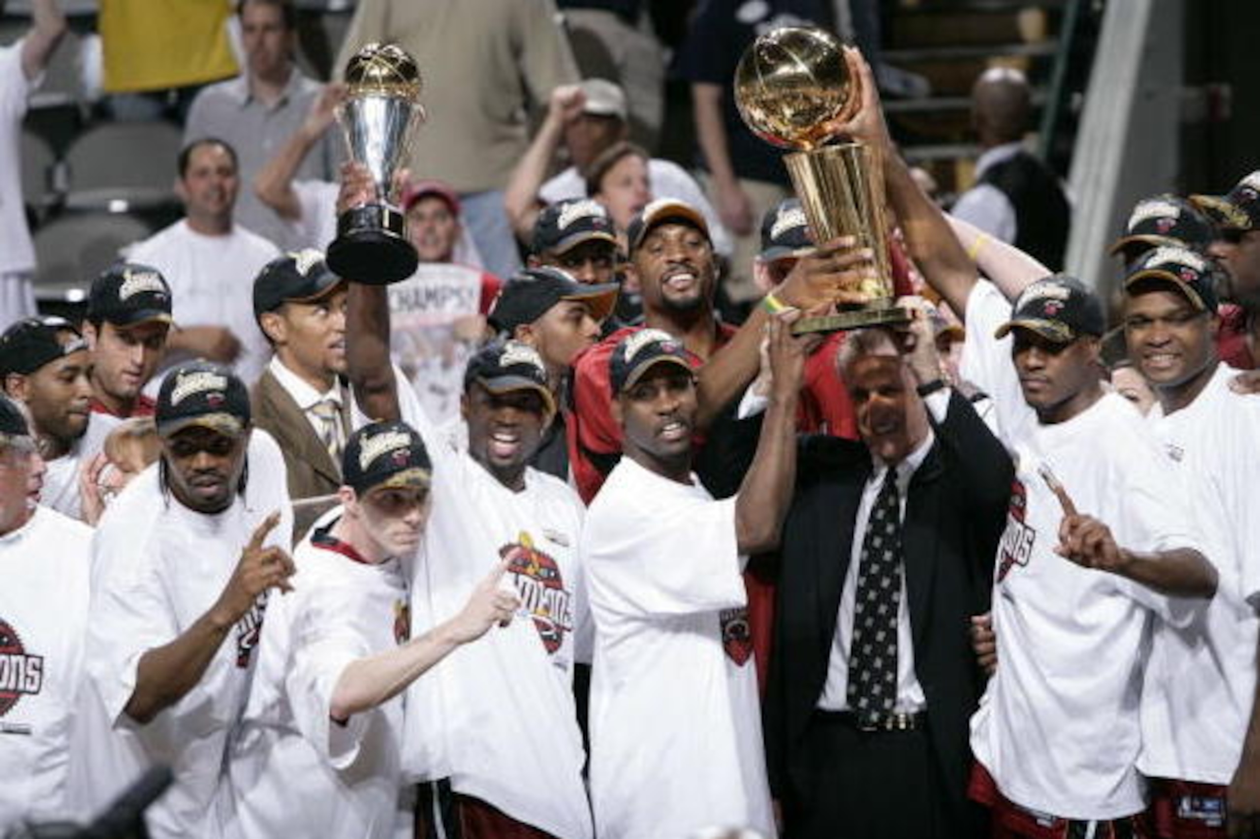 DALLAS - JUNE 20:  Dwyane Wade #3 and Pat Riley and the Miami Heat celebrates winning the NBA Championship in Game Six of the 2006 NBA Finals on June 20, 2006 at the American Airlines Center in Dallas, Texas. NOTE TO USER: User expressly acknowledges and 