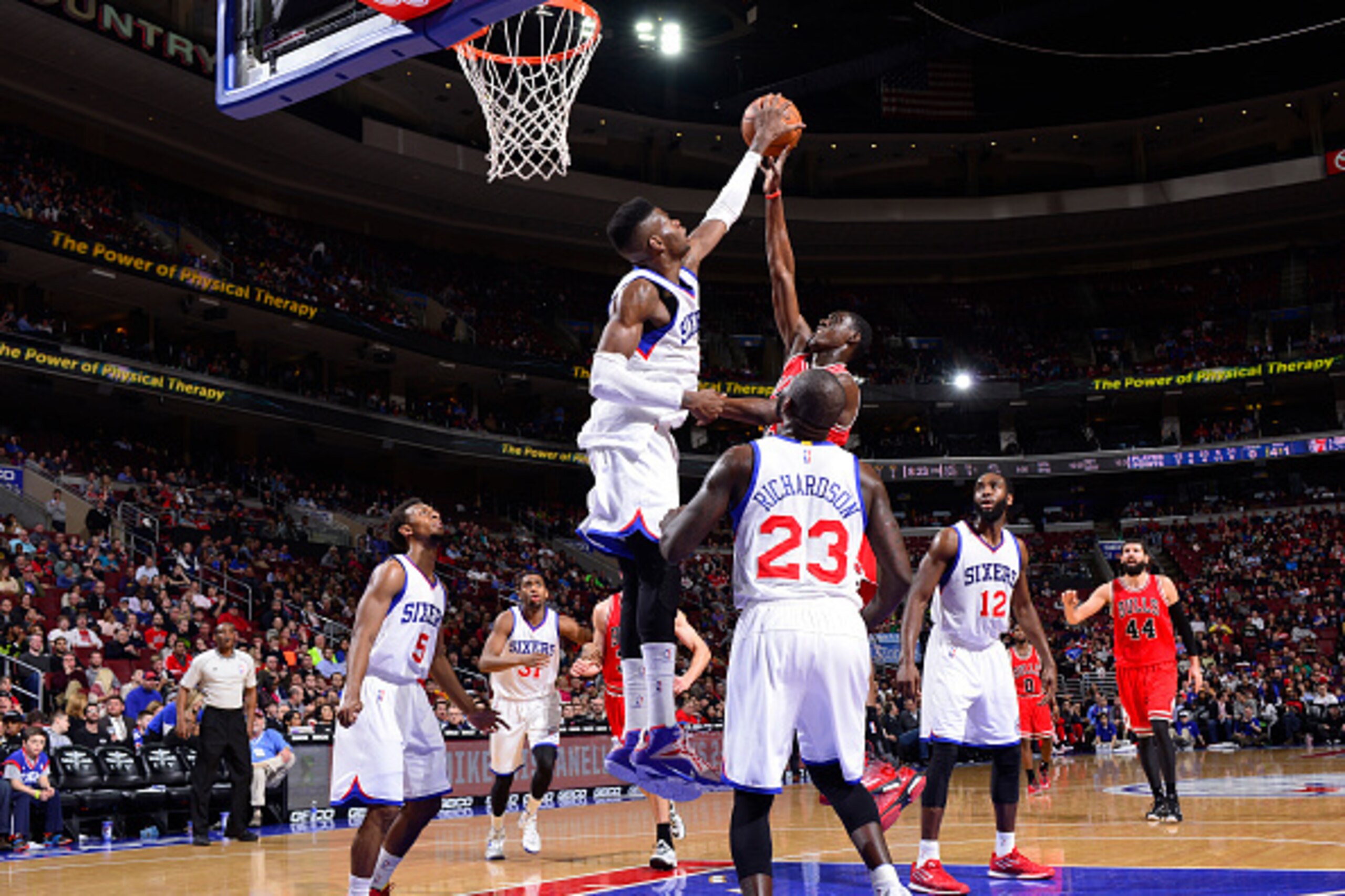 PHILADELPHIA - MARCH 11:  Nerlens Noel #4 of the Philadelphia 76ers makes a huge block against Tony Snell #20 of the Chicago Bulls at the Wells Fargo Center on March 11, 2015 in Philadelphia, Pennsylvania. NOTE TO USER: User expressly acknowledges and agr
