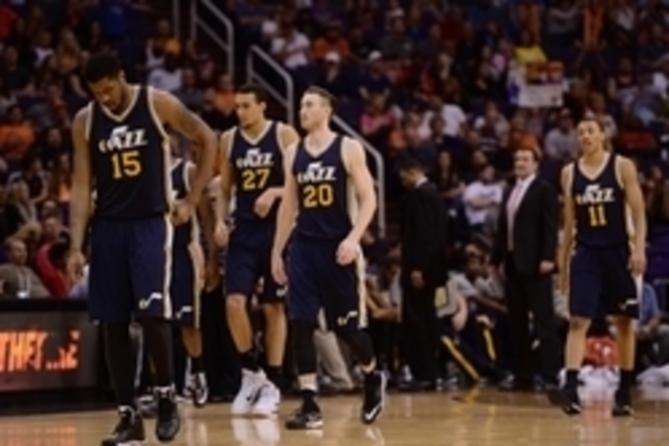 Feb 6, 2015; Phoenix, AZ, USA; Utah Jazz forward Derrick Favors (15) and center Rudy Gobert (27) and forward Gordon Hayward (20) and guard Dante Exum (11) look on against the Phoenix Suns at US Airways Center. Mandatory Credit: Joe Camporeale-USA TODAY Sp