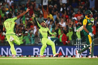 AUCKLAND, NEW ZEALAND - MARCH 07:  Wahab Riaz of Pakistan celebrates with Ahmad Shahzad of Pakistan after claiming the last wicket of  Imran Tahir of South Africa to win the 2015 ICC Cricket World Cup match between South Africa and Pakistan at Eden Park o