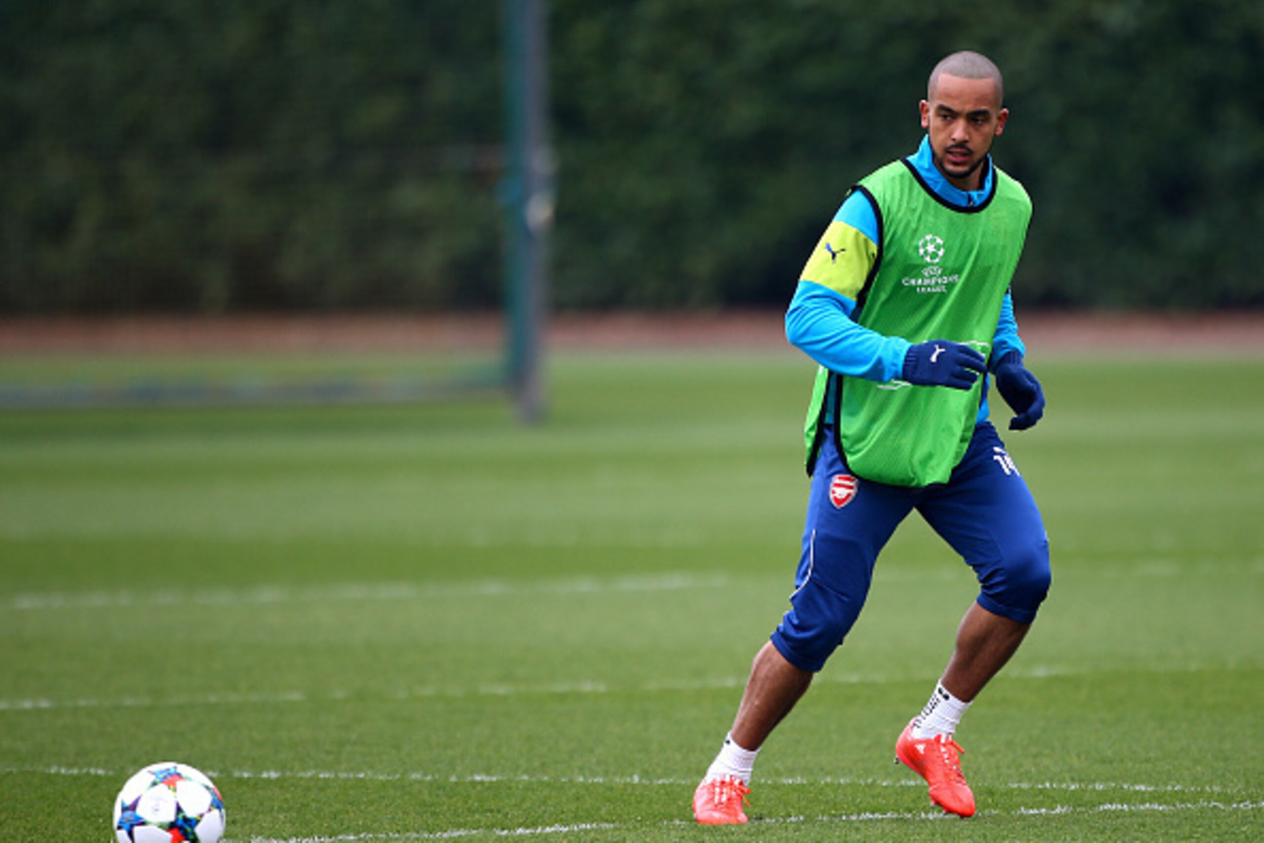 ST ALBANS, ENGLAND - MARCH 16: Arsenal's Theo Walcott warms up during the Arsenal Training Session ahead of their Champions League match against AS Monaco on March 16, 2015 in St Albans, England. (Photo by Charlie Crowhurst/Getty Images)