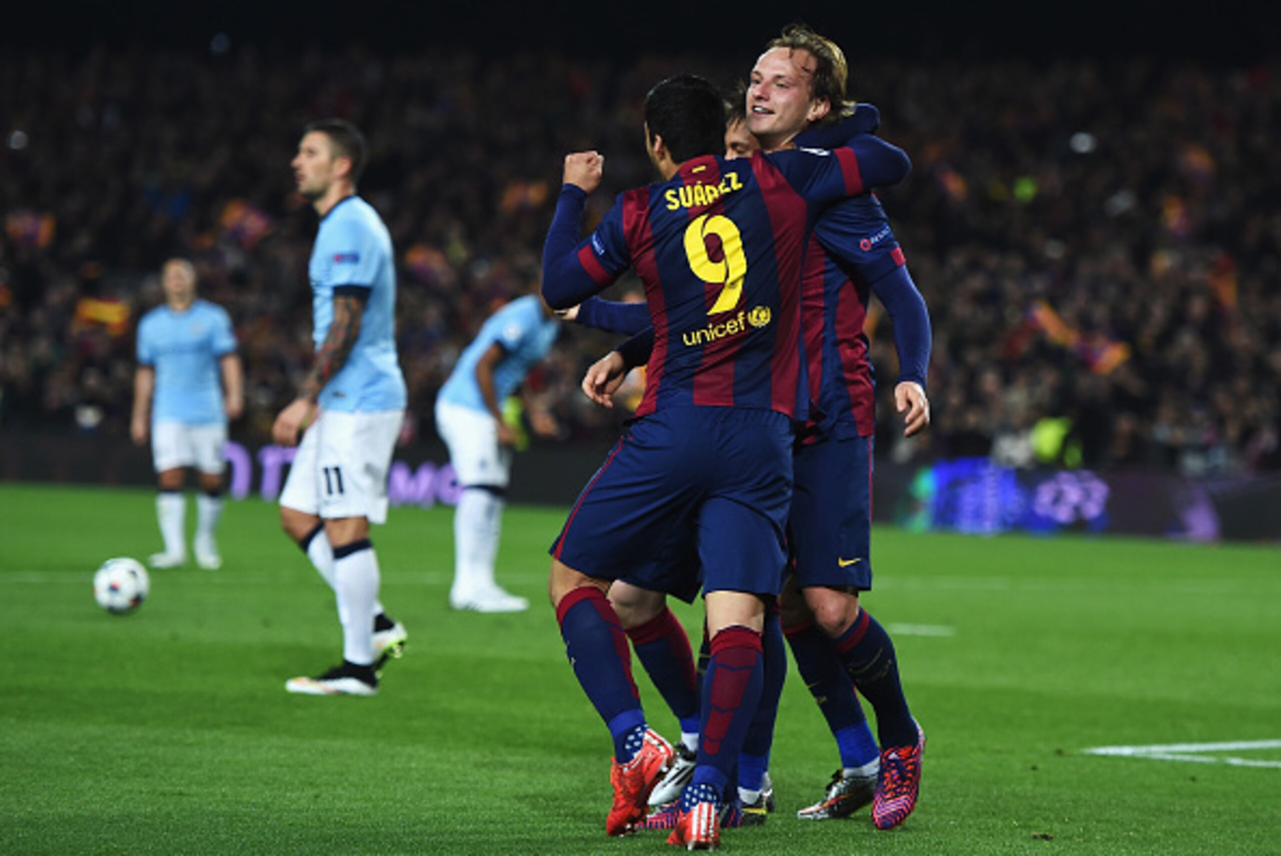 BARCELONA, SPAIN - MARCH 18:  Ivan Rakitic of Barcelona (R) celebrates scoring the opening goal with Neymar and Luis Suarez of Barcelona during the UEFA Champions League Round of 16 second leg match between Barcelona and Manchester City at Camp Nou on Mar