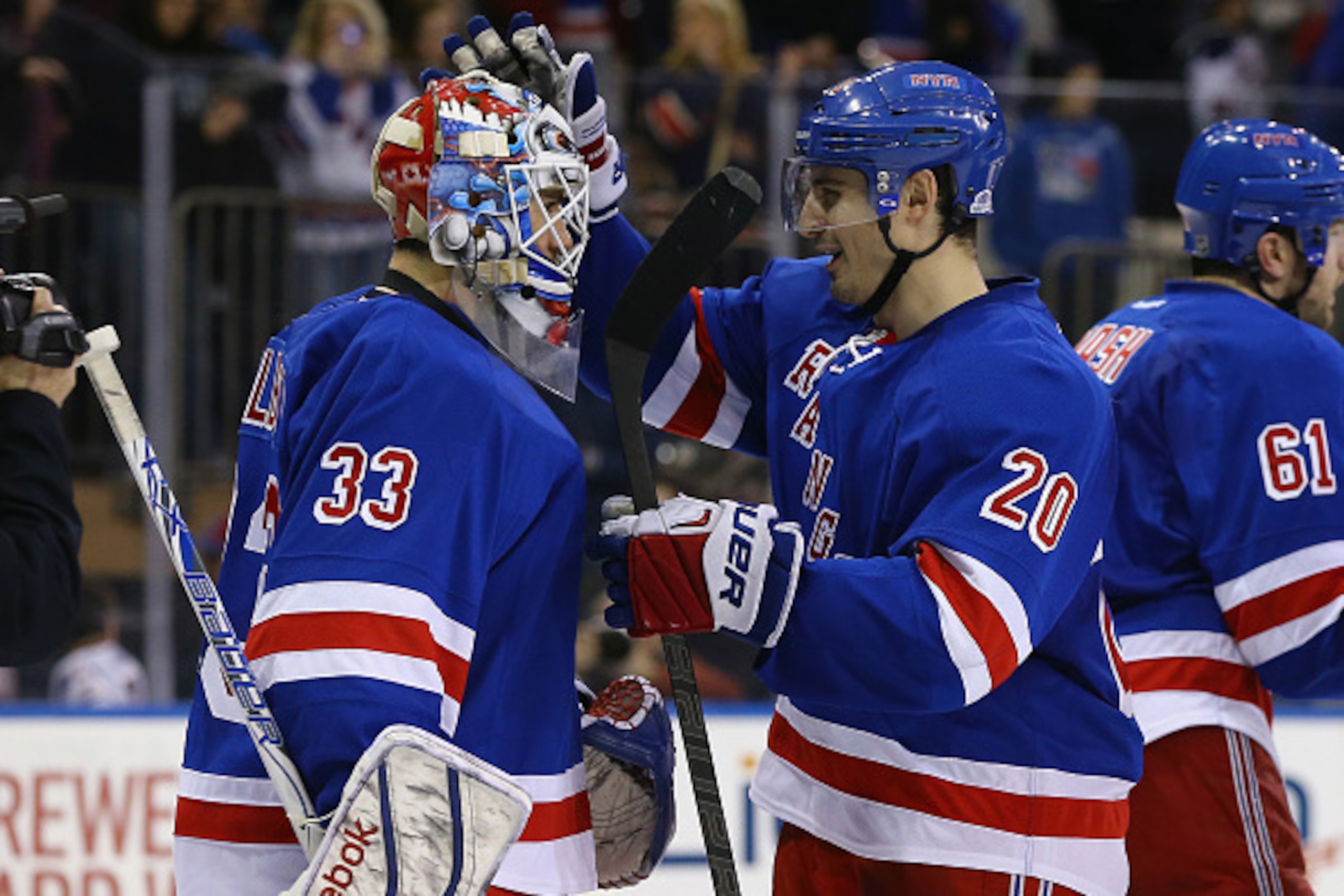 NEW YORK, NY - MARCH 15:  Cam Talbot #33 and Chris Kreider #20 of the New York Rangers celebrates a 2-1 win against the Florida Panthers after their game at Madison Square Garden on March 15, 2015 in New York City.  (Photo by Al Bello/Getty Images)