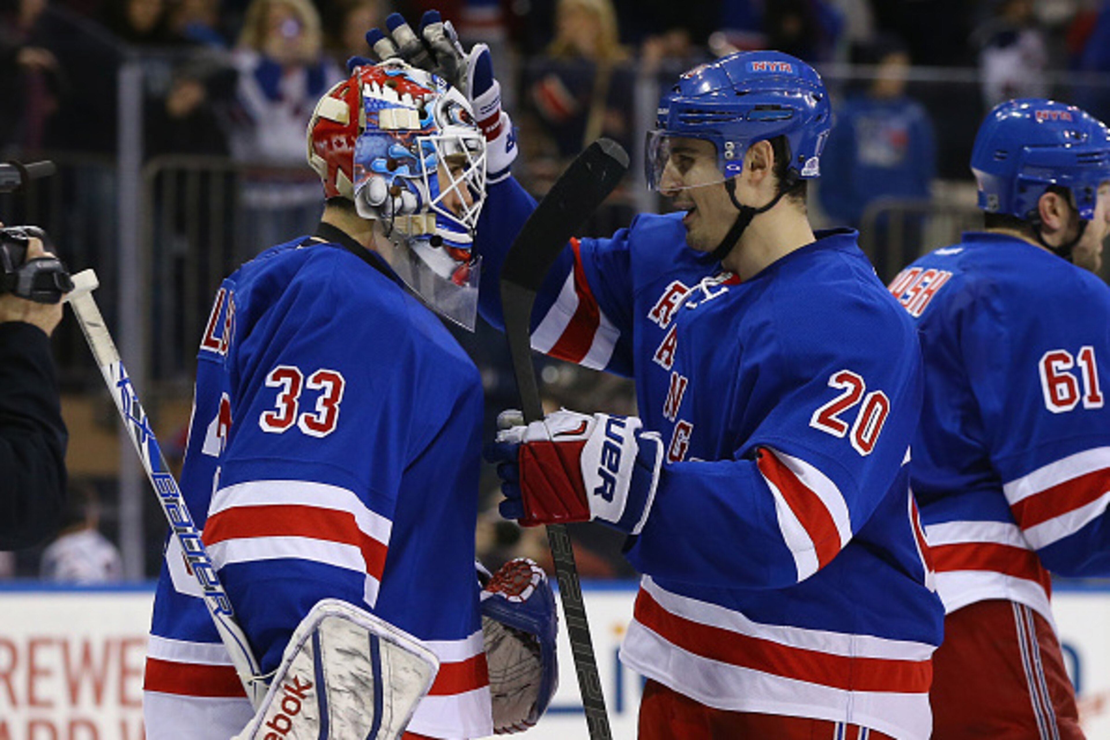 NEW YORK, NY - MARCH 15:  Cam Talbot #33 and Chris Kreider #20 of the New York Rangers celebrates a 2-1 win against the Florida Panthers after their game at Madison Square Garden on March 15, 2015 in New York City.  (Photo by Al Bello/Getty Images)