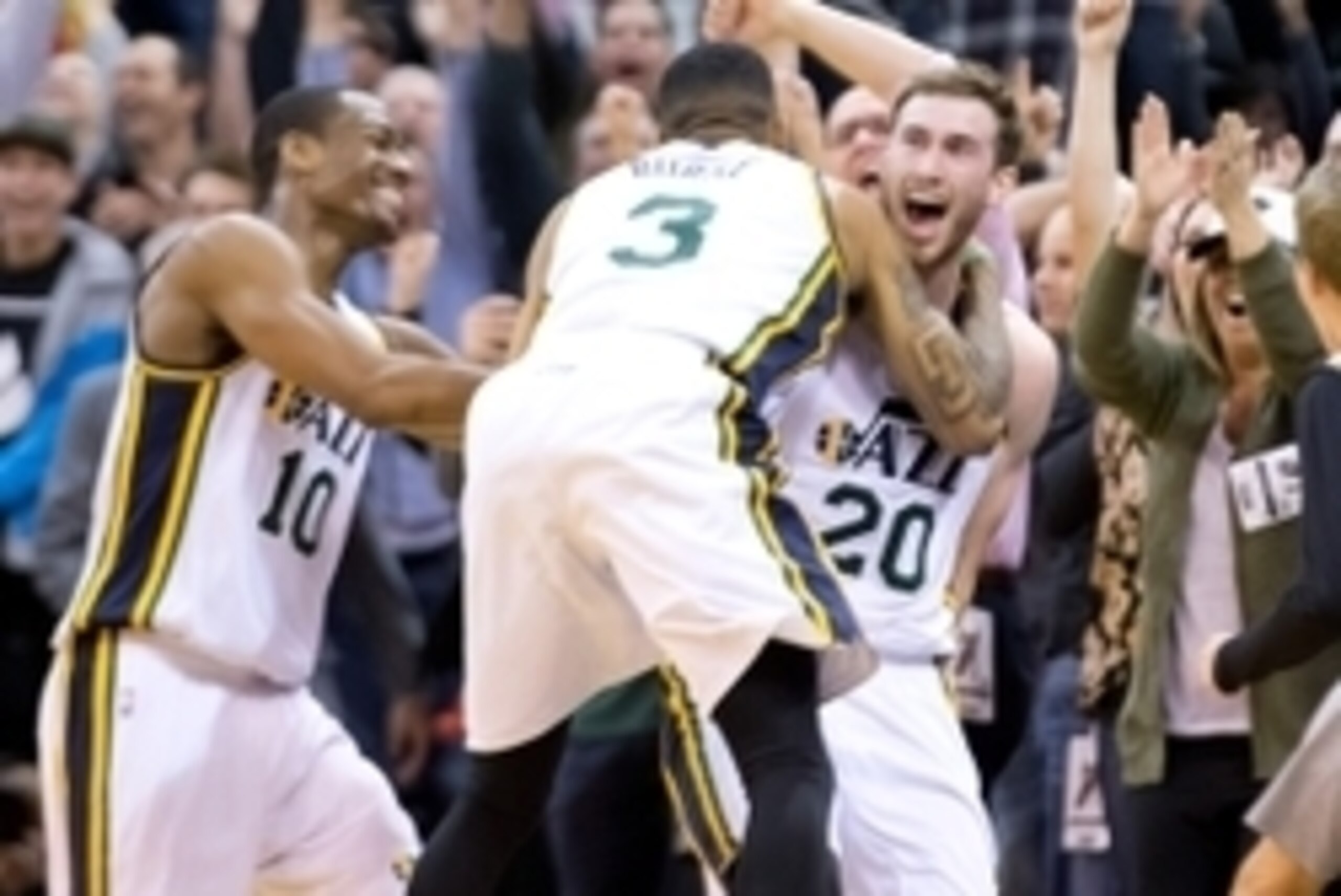 Nov 5, 2014; Salt Lake City, UT, USA; Utah Jazz guard Gordon Hayward (20) and guard Trey Burke (3) and guard Alec Burks (10) react to defeating the Cleveland Cavaliers 102-100 at EnergySolutions Arena. Mandatory Credit: Russ Isabella-USA TODAY Sports