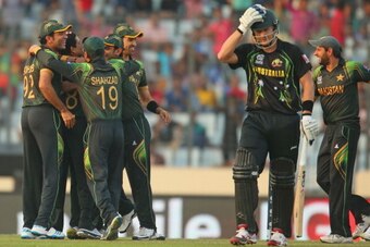 DHAKA, BANGLADESH - MARCH 23:  Zulfiqar Babar of Pakistan celebrates with his teammates after dismissing Shane Watson of Australia during the ICC World Twenty20 Bangladesh 2014 match between Australia and Pakistan at Sher-e-Bangla Mirpur Stadium on March 
