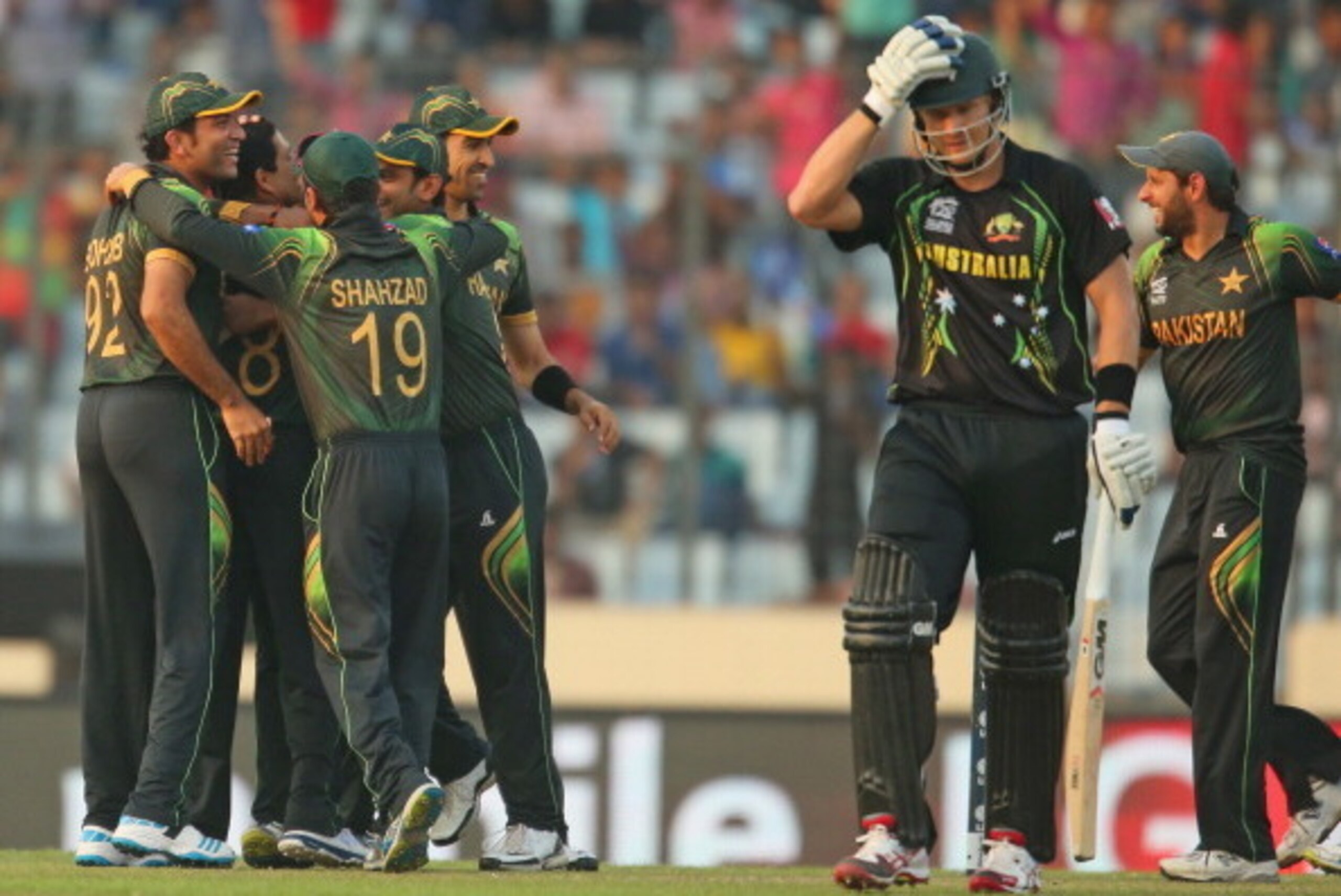 DHAKA, BANGLADESH - MARCH 23: Zulfiqar Babar of Pakistan celebrates with his teammates after dismissing Shane Watson of Australia during the ICC World Twenty20 Bangladesh 2014 match between Australia and Pakistan at Sher-e-Bangla Mirpur Stadium on March DHAKA, BANGLADESH - MARCH 23: Zulfiqar Babar of Pakistan celebrates with his teammates after dismissing Shane Watson of Australia during the ICC World Twenty20 Bangladesh 2014 match between Australia and Pakistan at Sher-e-Bangla Mirpur Stadium on March