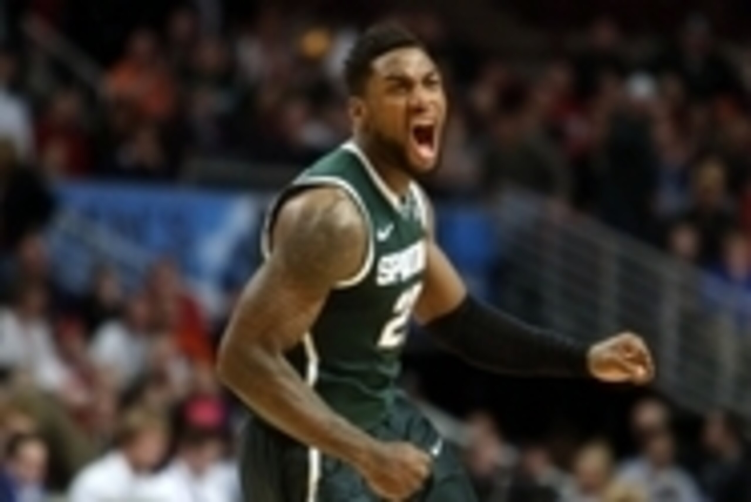 Mar 15, 2015; Chicago, IL, USA; Michigan State Spartans guard/forward Branden Dawson (22) reacts as he heads into a timeout against the Wisconsin Badgers during the second half in the championship game of the Big Ten Tournament at United Center. Mandatory