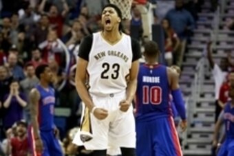 Mar 4, 2015; New Orleans, LA, USA; New Orleans Pelicans forward Anthony Davis (23) reacts after a basket by guard Tyreke Evans during the fourth quarter of a game against the Detroit Pistons at the Smoothie King Center. The Pelicans defeated the Pistons 8