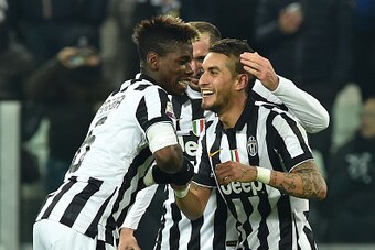 TURIN, ITALY - JANUARY 18:  Roberto Pereyra (R) of Juventus FC celebrates a goal with team mate Paul Pogba (L) during the Serie A match between Juventus FC and Hellas Verona FC at Juventus Arena on January 18, 2015 in Turin, Italy.  (Photo by Valerio Penn