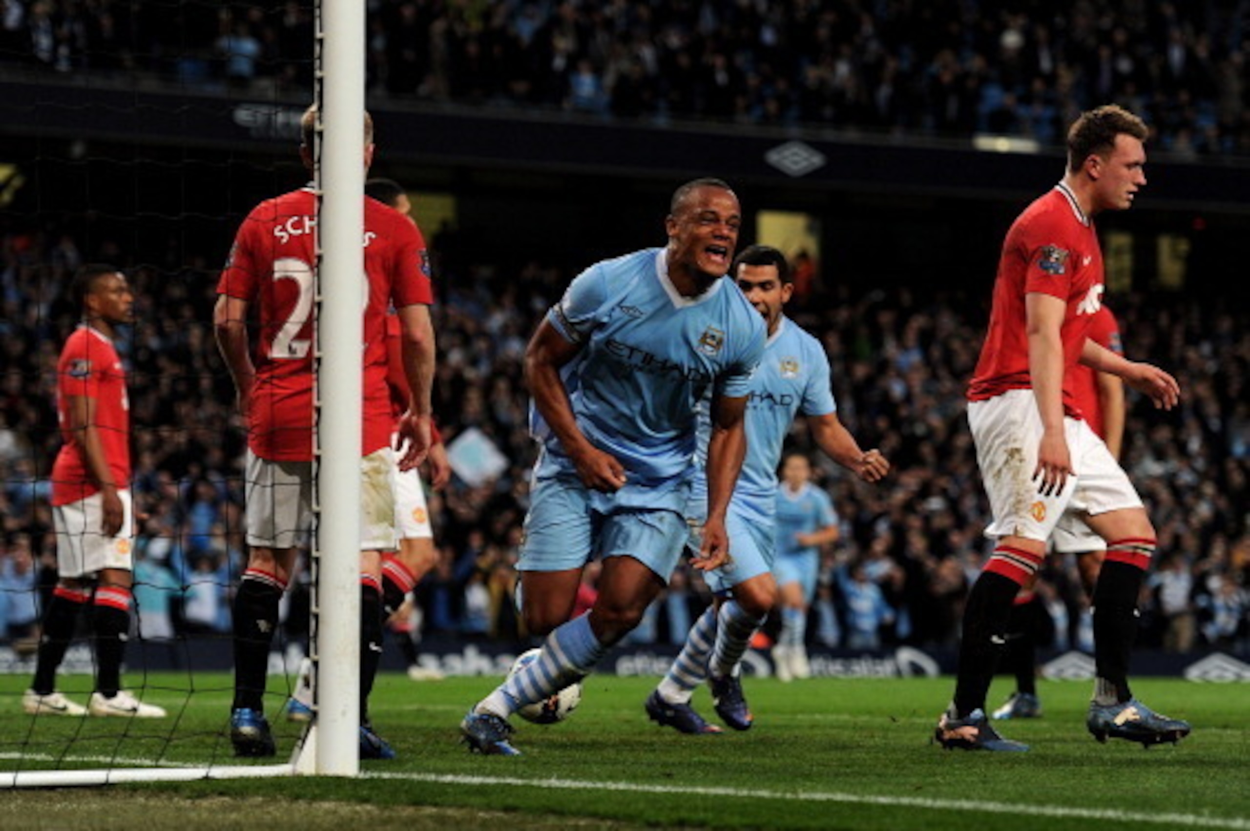 MANCHESTER, ENGLAND - APRIL 30:  Vincent Kompany of Manchester City celebrates scoring the opening goal during the Barclays Premier League match between Manchester City and Manchester United at the Etihad Stadium on April 30, 2012 in Manchester, England. 