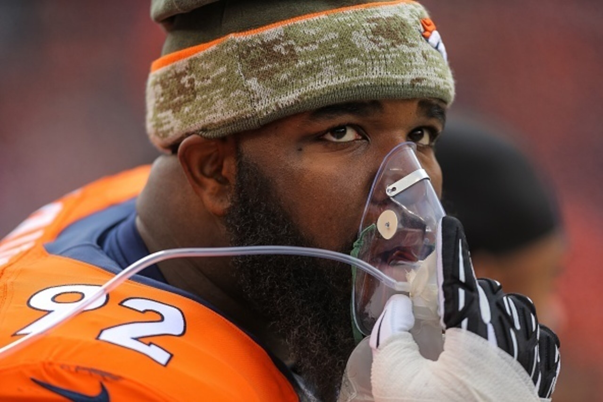 DENVER, CO - NOVEMBER 23: Defensive tackle Sylvester Williams #92 of the Denver Broncos takes oxygen as he prepares to face the Miami Dolphins before a game at Sports Authority Field at Mile High on November 23, 2014 in Denver, Colorado.  (Photo by Justin