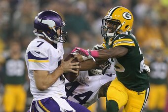 GREEN BAY, WI - OCTOBER 02:  Casey Hayward #29 of the Green Bay Packers rushes quarterback  Christian Ponder #7 of the Minnesota Vikings at Lambeau Field on October 2, 2014 in Green Bay, Wisconsin. Packers defeat Vikings 42-10.(Photo by Jonathan Daniel/Ge