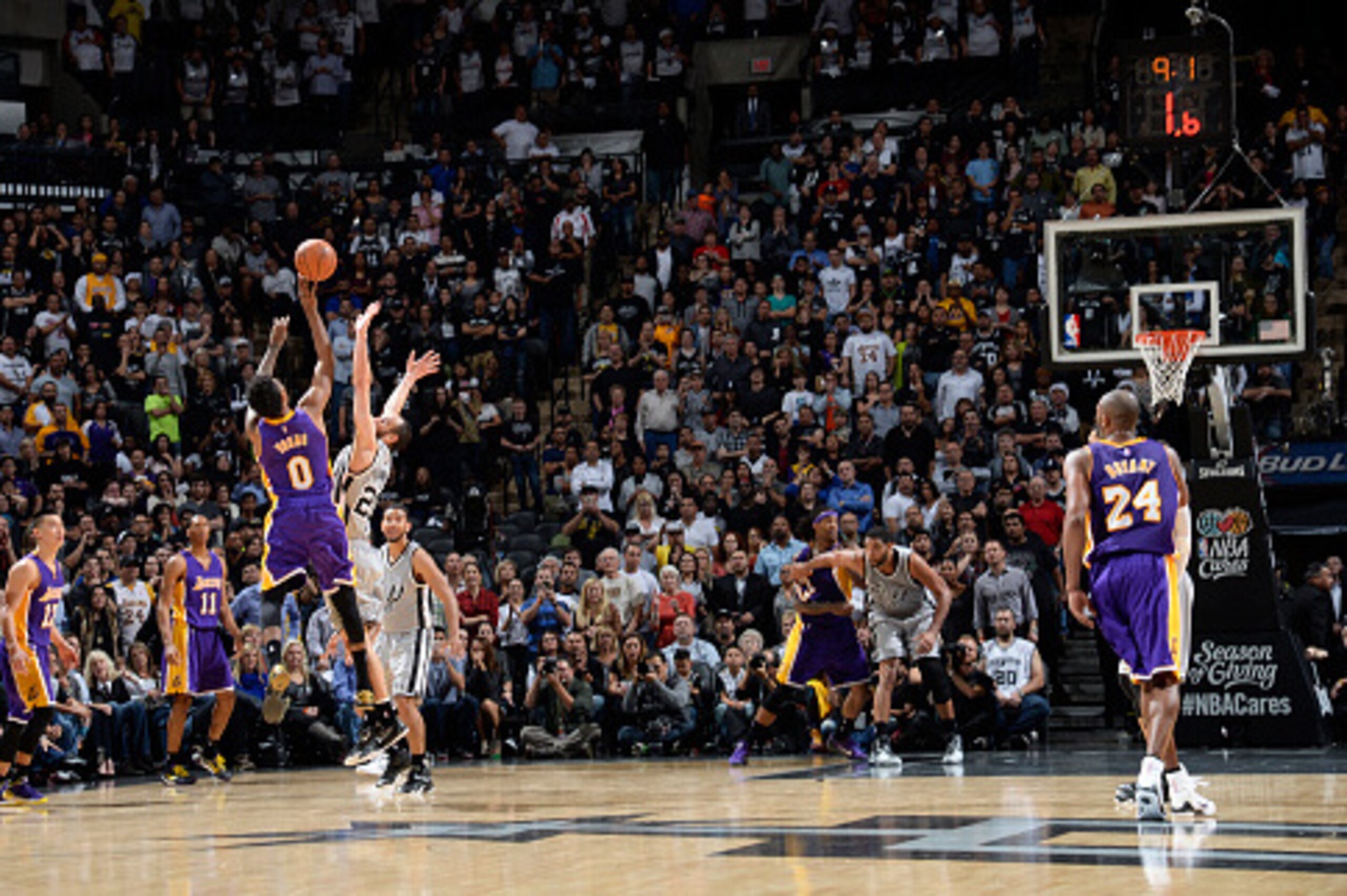 SAN ANTONIO - DECEMBER 12: Nick Young #0 of the Los Angeles Lakers takes a shot in the final seconds of OT to win the game against the San Antonio Spurs at the AT&T Center on December 12, 2014 in San Antonio, Texas. NOTE TO USER: User expressly acknowledg SAN ANTONIO - DECEMBER 12: Nick Young #0 of the Los Angeles Lakers takes a shot in the final seconds of OT to win the game against the San Antonio Spurs at the AT&T Center on December 12, 2014 in San Antonio, Texas. NOTE TO USER: User expressly acknowledg