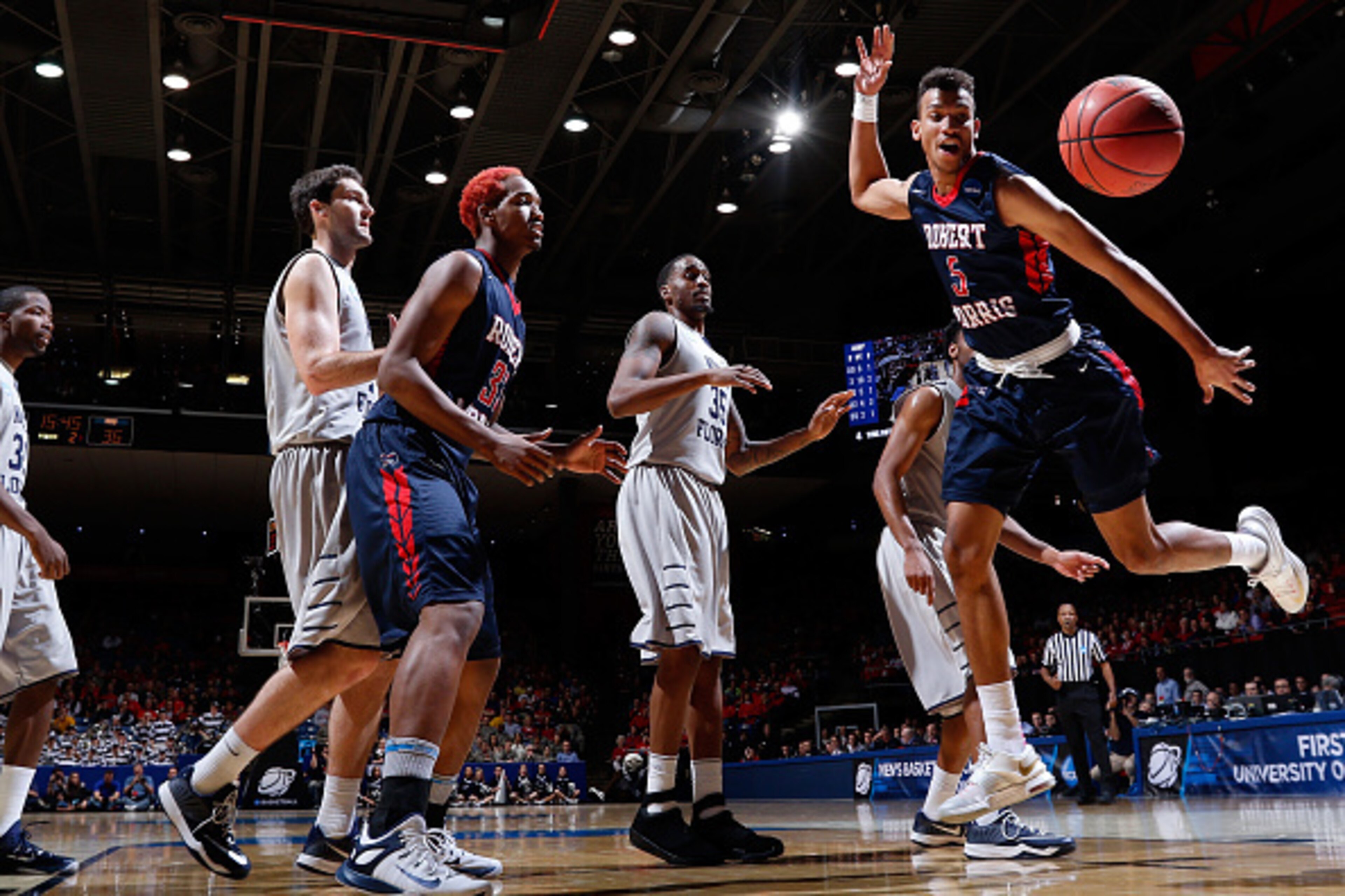 DAYTON, OH - MARCH 18: Elijah Minnie #5 of the Robert Morris Colonials loses control of the ball against the North Florida Ospreys during the first round of the 2015 NCAA Men's Basketball Tournament at UD Arena on March 18, 2015 in Dayton, Ohio.  (Photo b