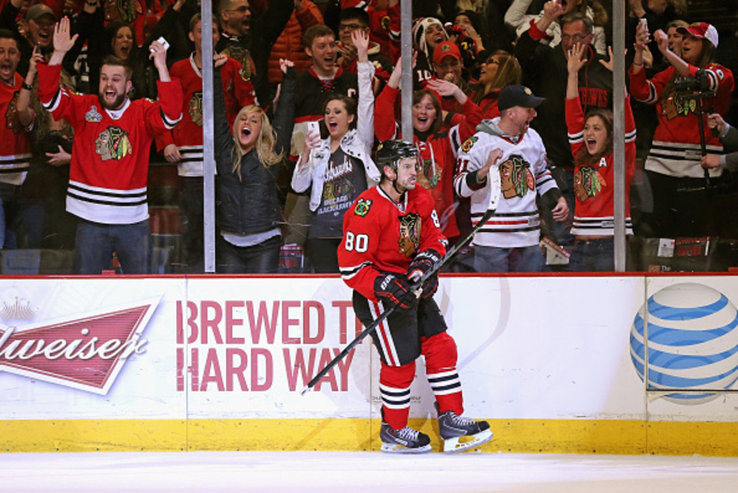 CHICAGO, IL - MARCH 06: Fans cheers as Antoine Vermette #80 of the Chicago Blackhawks celebrates his game-winning goal in the shootout against the Edmonton Oilers at the United Center on March 6, 2015 in Chicago, Illinois. The Blackhawks defeated the Oile