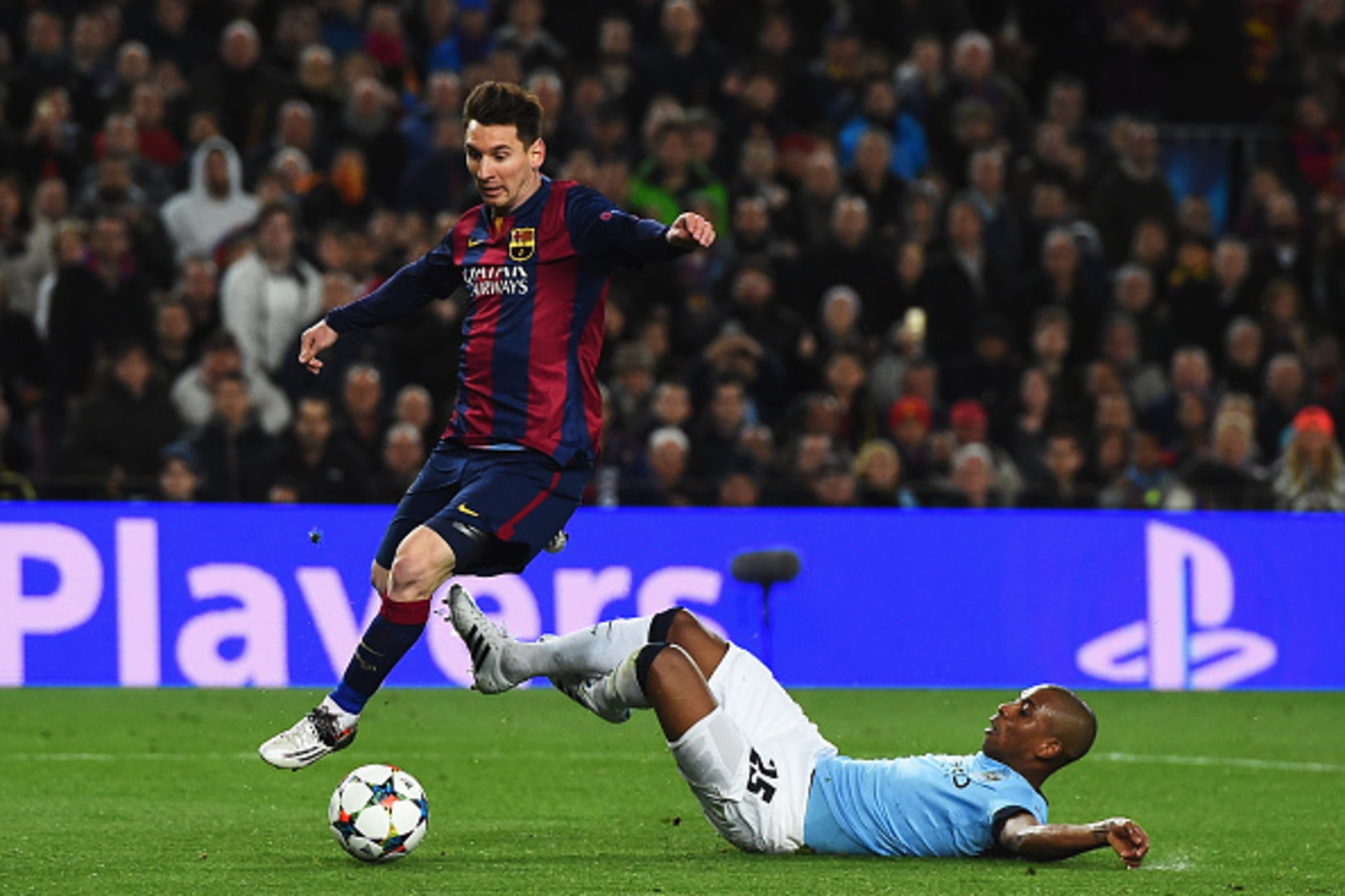BARCELONA, SPAIN - MARCH 18:  Lionel Messi of Barcelona skips past Fernandinho of Manchester City during the UEFA Champions League Round of 16 second leg match between Barcelona and Manchester City at Camp Nou on March 18, 2015 in Barcelona, Spain.  (Phot