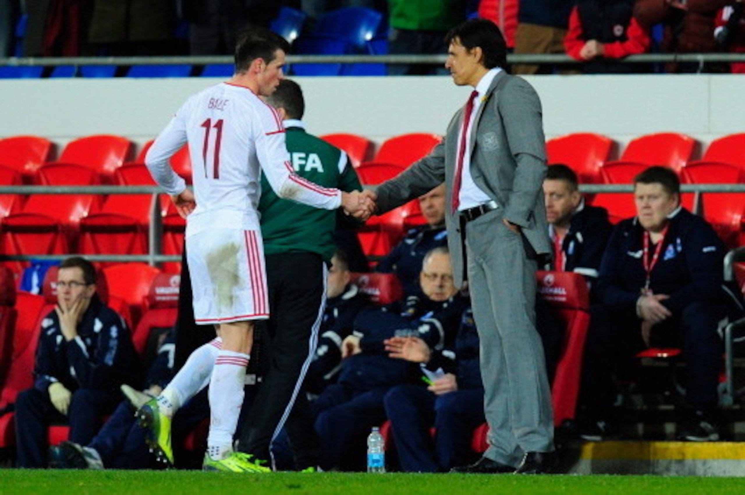 CARDIFF, WALES - MARCH 05:  Wales player Gareth Bale (l) is congratulated by manager Chris Coleman after being substituted after he had scored the third Wales goal during the International Friendly between Wales and Iceland at Cardiff City stadium on Marc