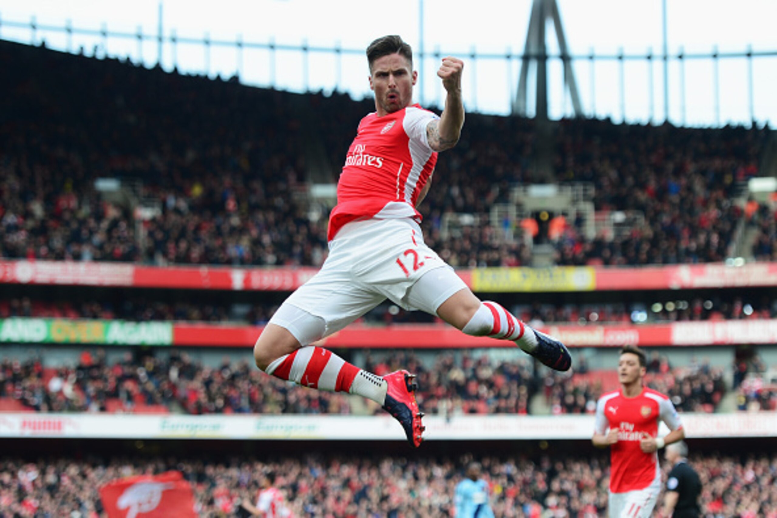 LONDON, ENGLAND - MARCH 14: Olivier Giroud of Arsenal celebrates scoring the opening goal during the Barclays Premier League match between Arsenal and West Ham United at Emirates Stadium on March 14, 2015 in London, England.  (Photo by Jamie McDonald/Gett