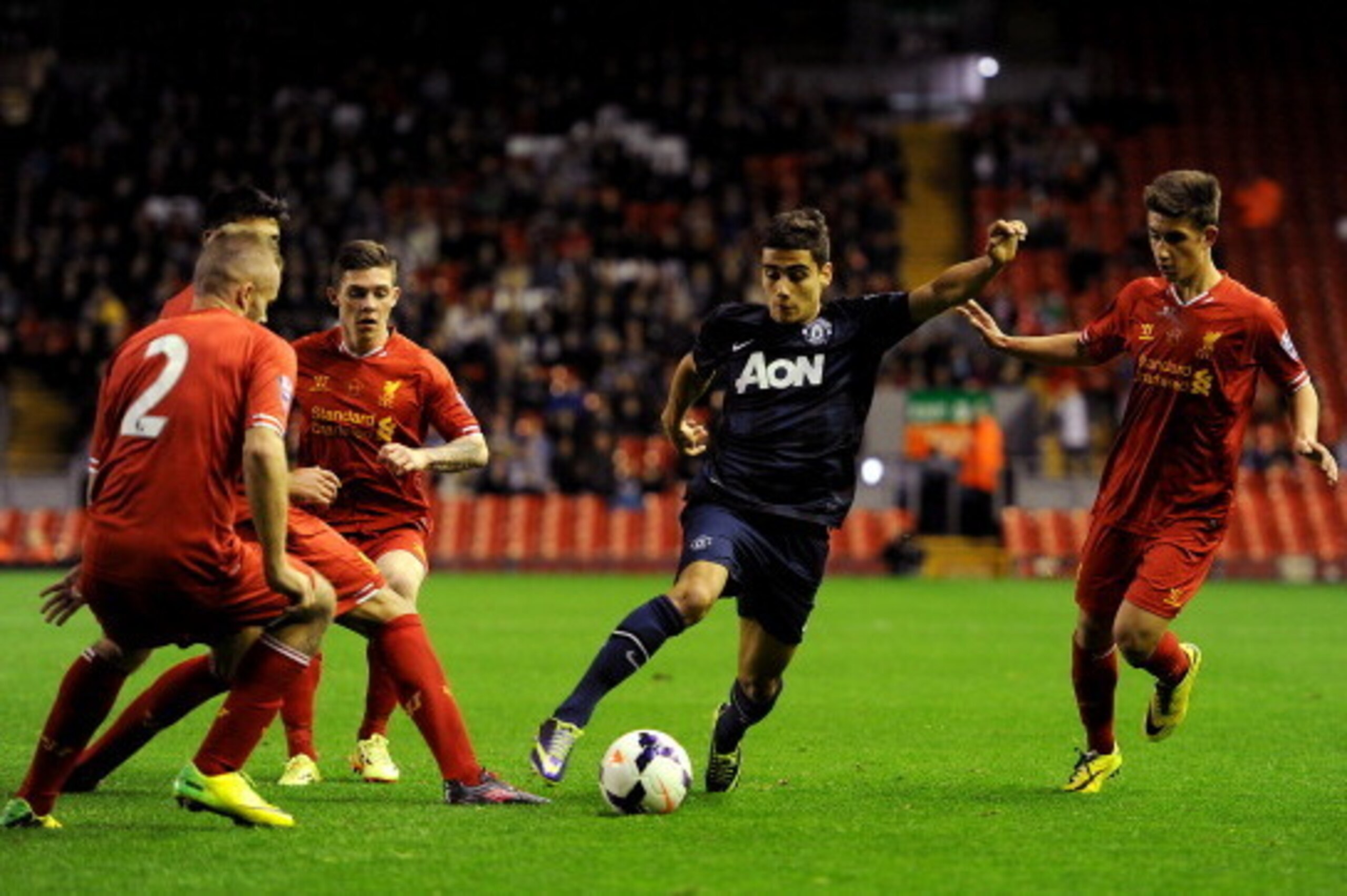 LIVERPOOL, ENGLAND - MAY 02: Andreas Pereira of Manchester United runs at the Liverpool defence during the Barclays U21 Premier League Semi Final match between Liverpool and Manchester United at Anfield on May 02, 2014 in Liverpool, England. (Photo by Chr