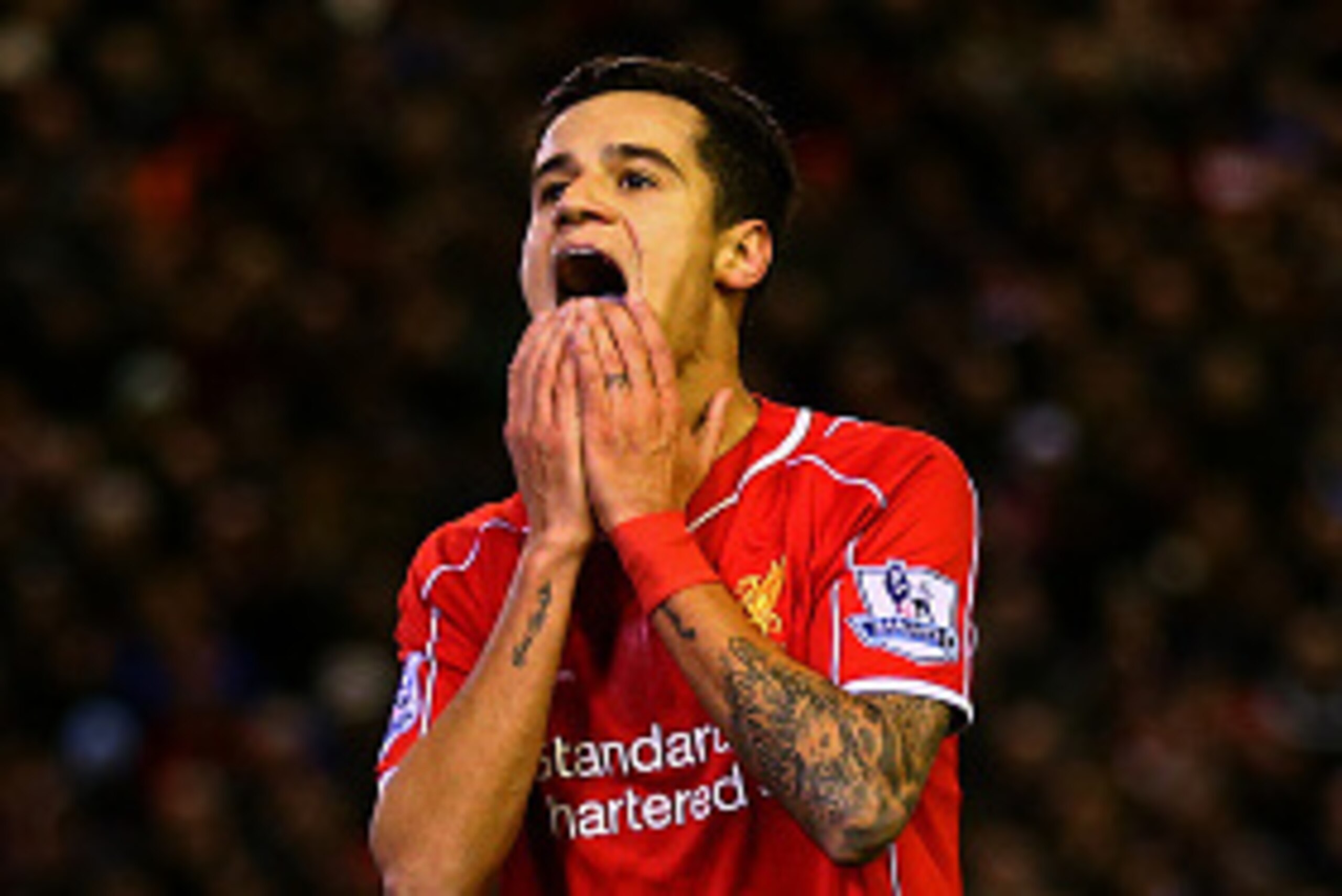 LIVERPOOL, ENGLAND - DECEMBER 29:  Philippe Coutinho of Liverpool reacts after a missed opportunity during the Barclays Premier League match between Liverpool and Swansea City at Anfield on December 29, 2014 in Liverpool, England.  (Photo by Clive Brunski