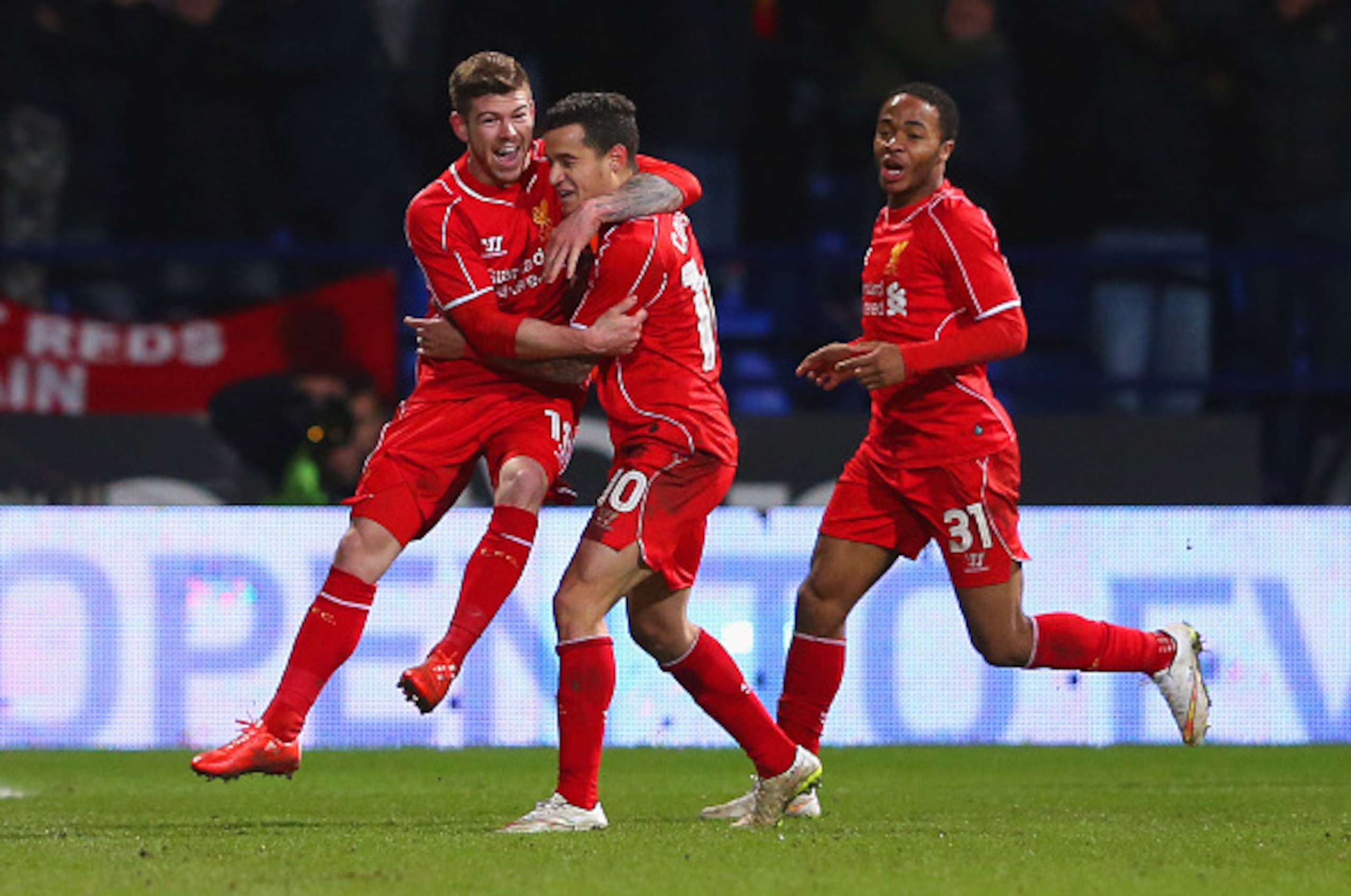 BOLTON, ENGLAND - FEBRUARY 04:  Philippe Coutinho of Liverpool celebrates scoring their second goal with Alberto Moreno and Raheem Sterling (R) of Liverpool during the FA Cup Fourth round replay between Bolton Wanderers and Liverpool at Macron Stadium on 