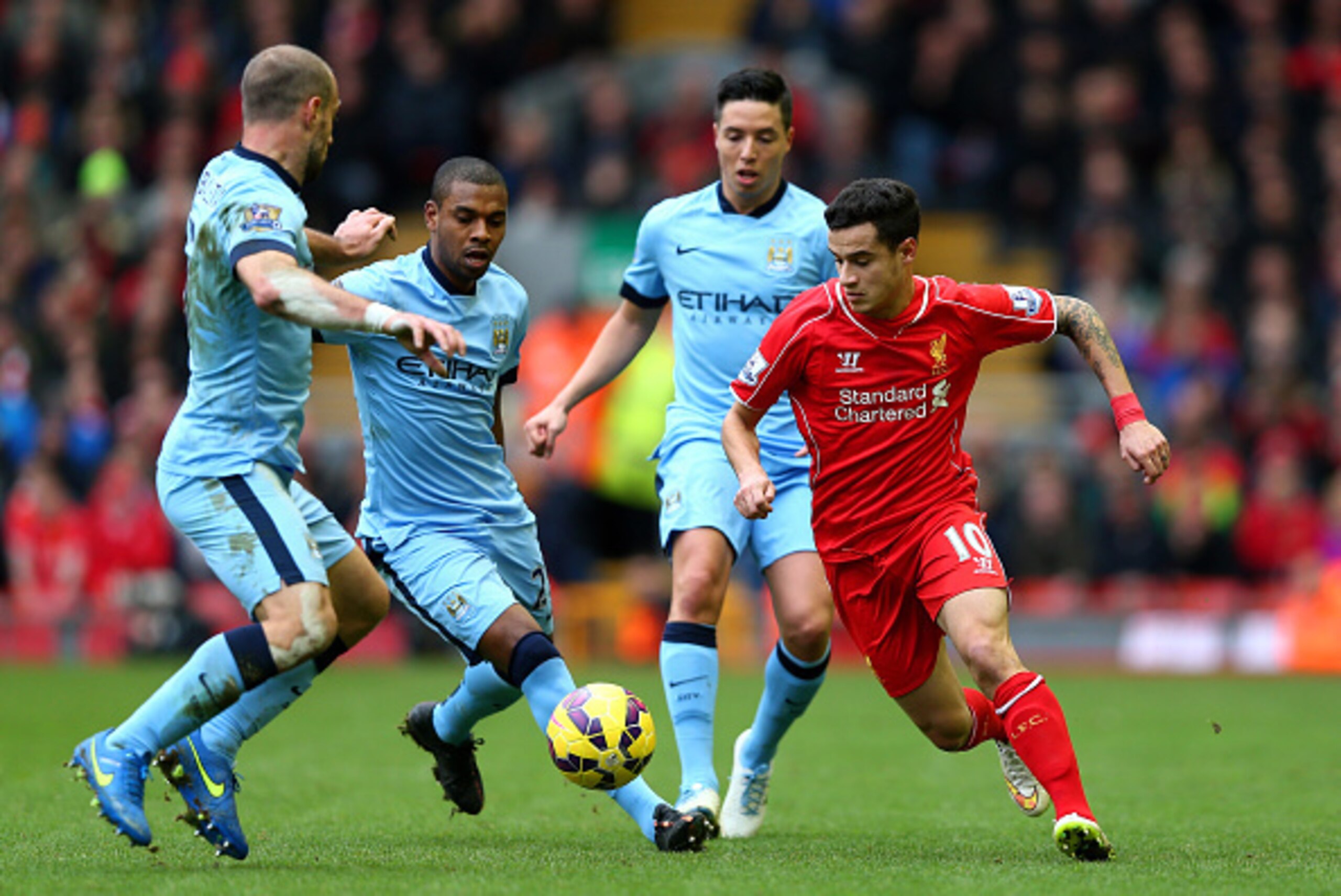 LIVERPOOL, ENGLAND - MARCH 01: Philippe Coutinho of Liverpool is closed down by Manchester City defence during the Barclays Premier League match between Liverpool and Manchester City at Anfield on March 1, 2015 in Liverpool, England. (Photo by Clive Bru LIVERPOOL, ENGLAND - MARCH 01: Philippe Coutinho of Liverpool is closed down by Manchester City defence during the Barclays Premier League match between Liverpool and Manchester City at Anfield on March 1, 2015 in Liverpool, England. (Photo by Clive Bru