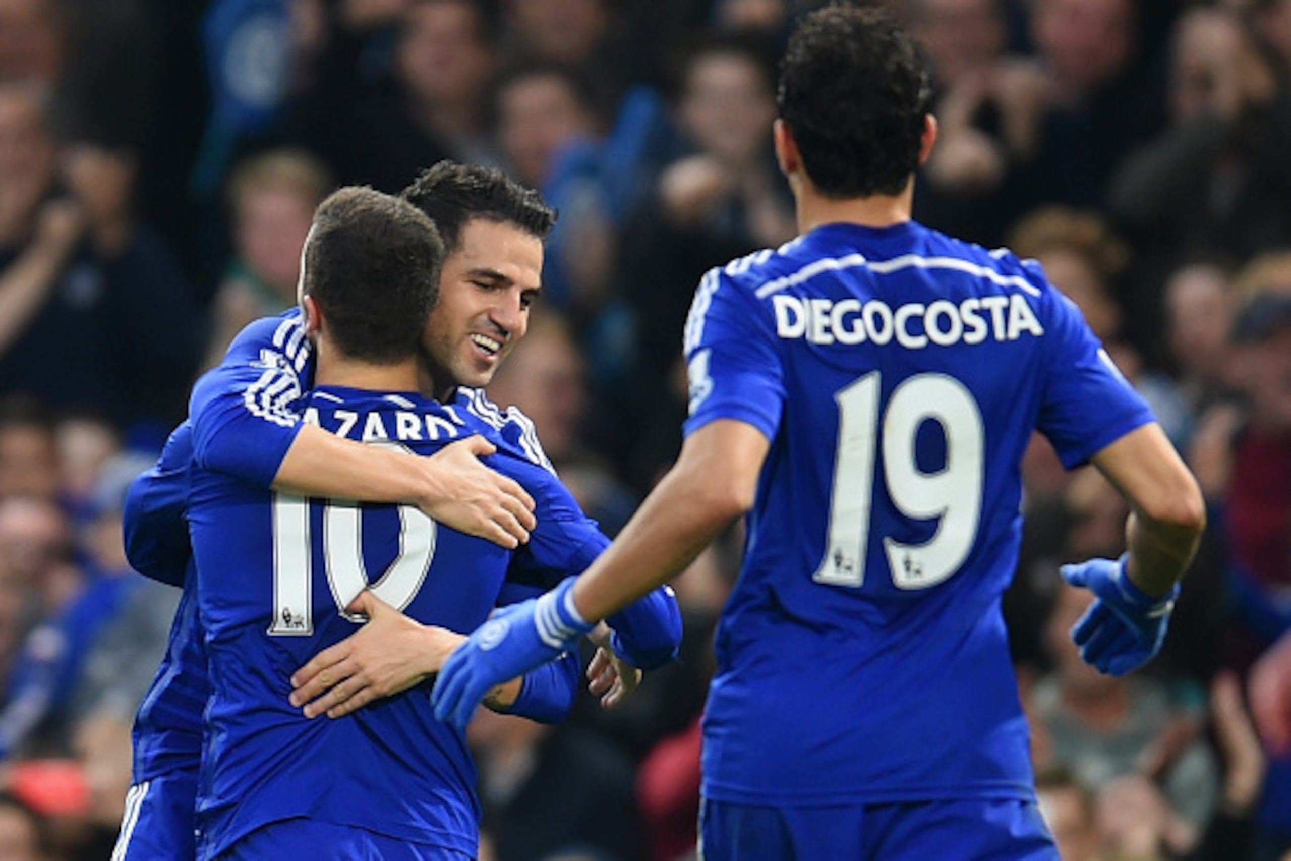 LONDON, ENGLAND - NOVEMBER 22:  Cesc Fabregas of Chelsea hugs Eden Hazard of Chelsea after he scored their second goal during the Barclays Premier League match between Chelsea and West Bromwich Albion at Stamford Bridge on November 22, 2014 in London, Eng