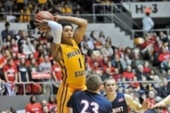 Mar 7, 2015; Nashville, TN, USA; Murray State Racers guard Cameron Payne (1) passes against Belmont Bruins guard Craig Bradshaw (23) during the first half at Nashville Municipal Auditorium. Mandatory Credit: Jim Brown-USA TODAY Sports
