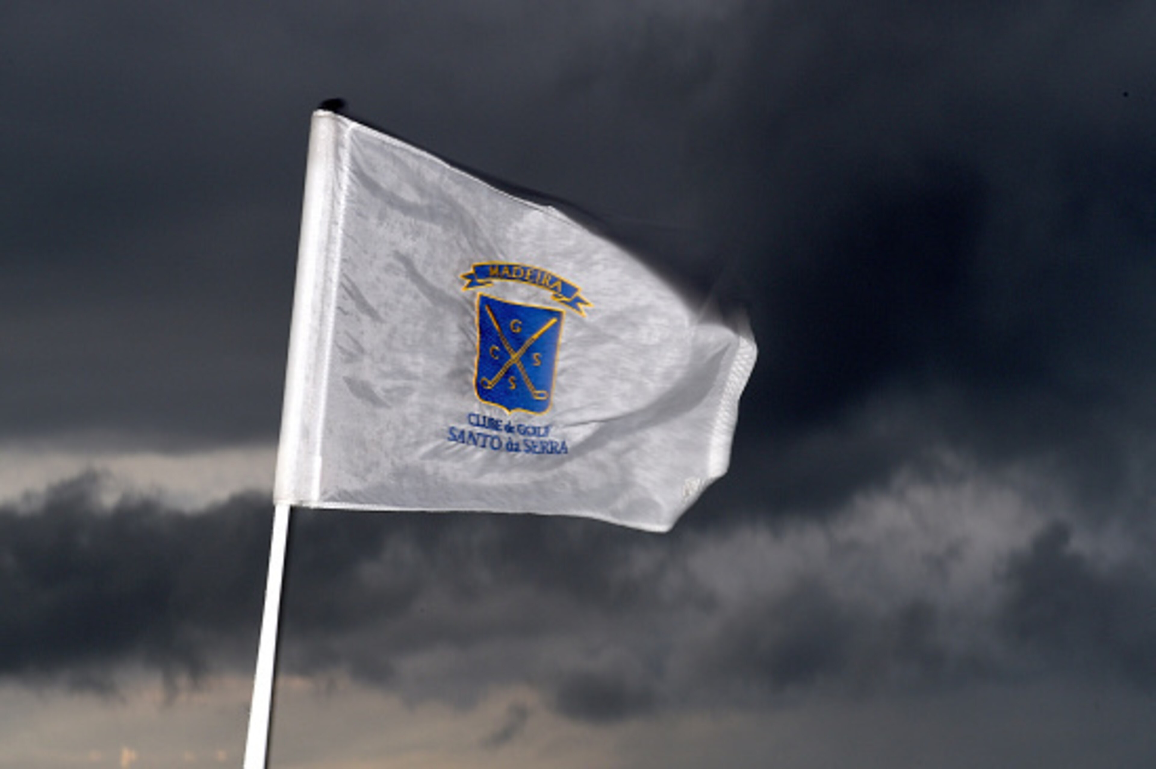 FUNCHAL, MADEIRA, PORTUGAL - MARCH 19:  A pin flga blowing in the wind prior to the delayed first round of the Madeira Islands Open at the Santo da Serra Golf Club in Santo da Serra on March 19, 2015 in Funchal, Madeira, Portugal.  (Photo by Ross Kinnaird