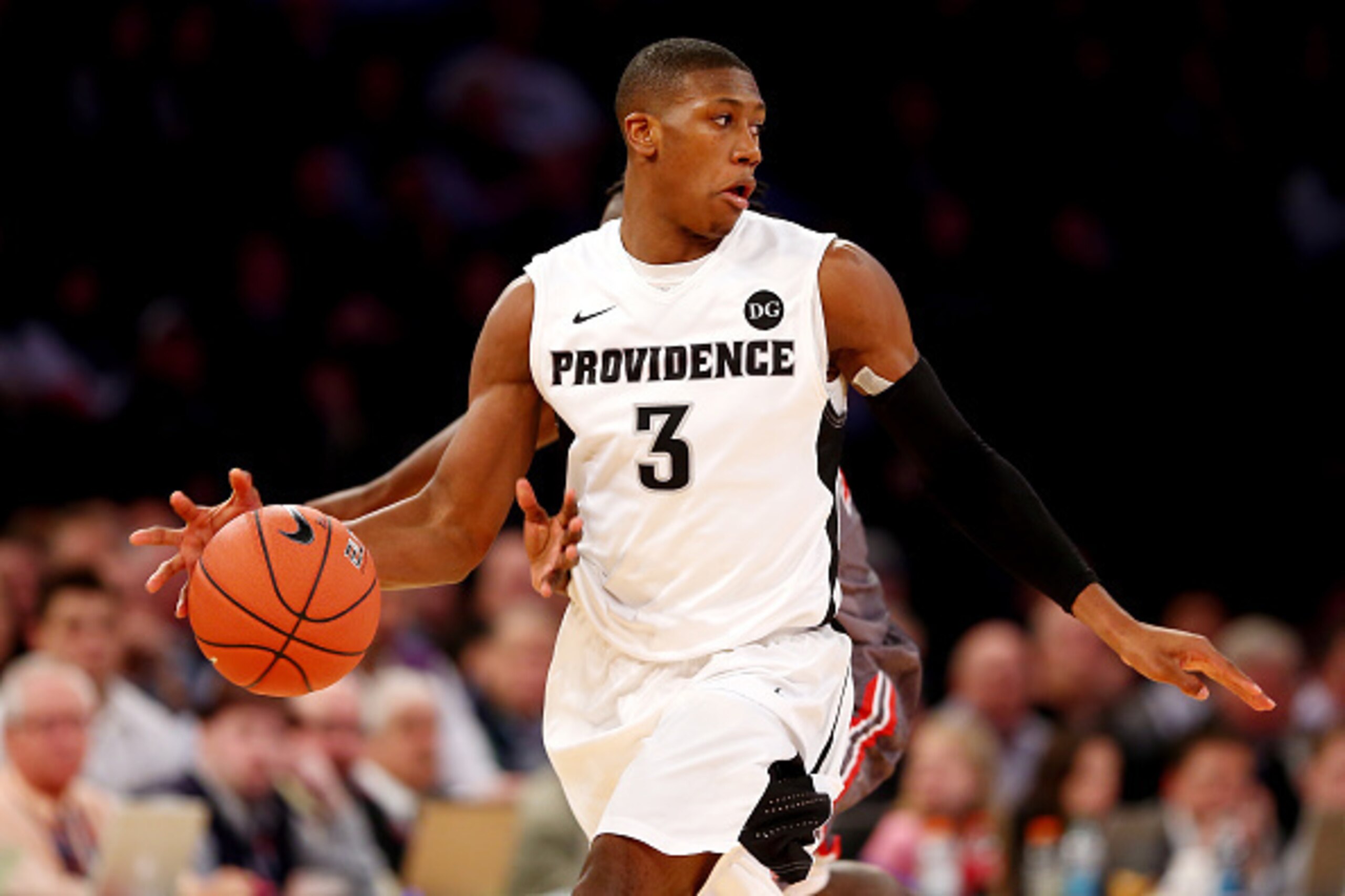NEW YORK, NY - MARCH 12: Kris Dunn #3 of the Providence Friars brings the ball up the floor under pressure by the St. John's Red Storm during a quarterfinal game of the Big East basketball tournament at Madison Square Garden on March 12, 2015 in New York 