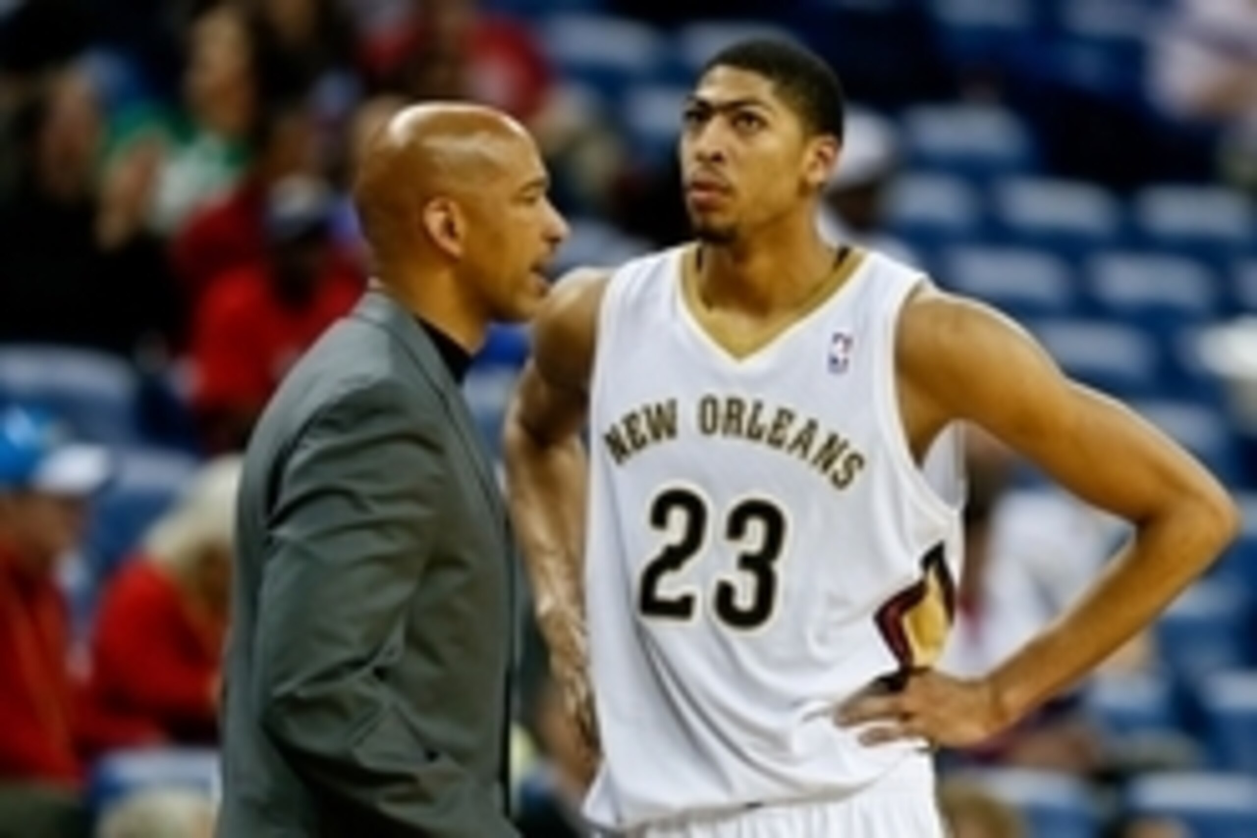 Feb 24, 2014; New Orleans, LA, USA; New Orleans Pelicans head coach Monty Williams talks with power forward Anthony Davis (23) during the fourth quarter at the Smoothie King Center. The Clippers defeated the Pelicans 123-110. Mandatory Credit: Derick E. H
